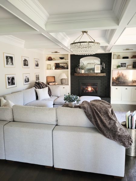 Living room inspo with black fireplace,  coffered ceiling,  sectional sofa, shelf decor,  shelfie, modern classic

#LTKhome