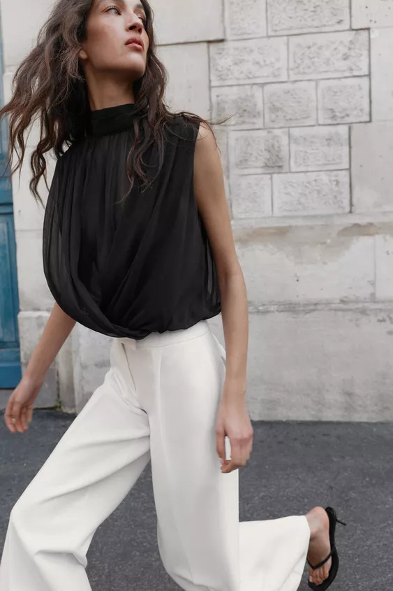High neck sleeveless top with back tie. Crossover balloon hem with interior elastic. | Zara US