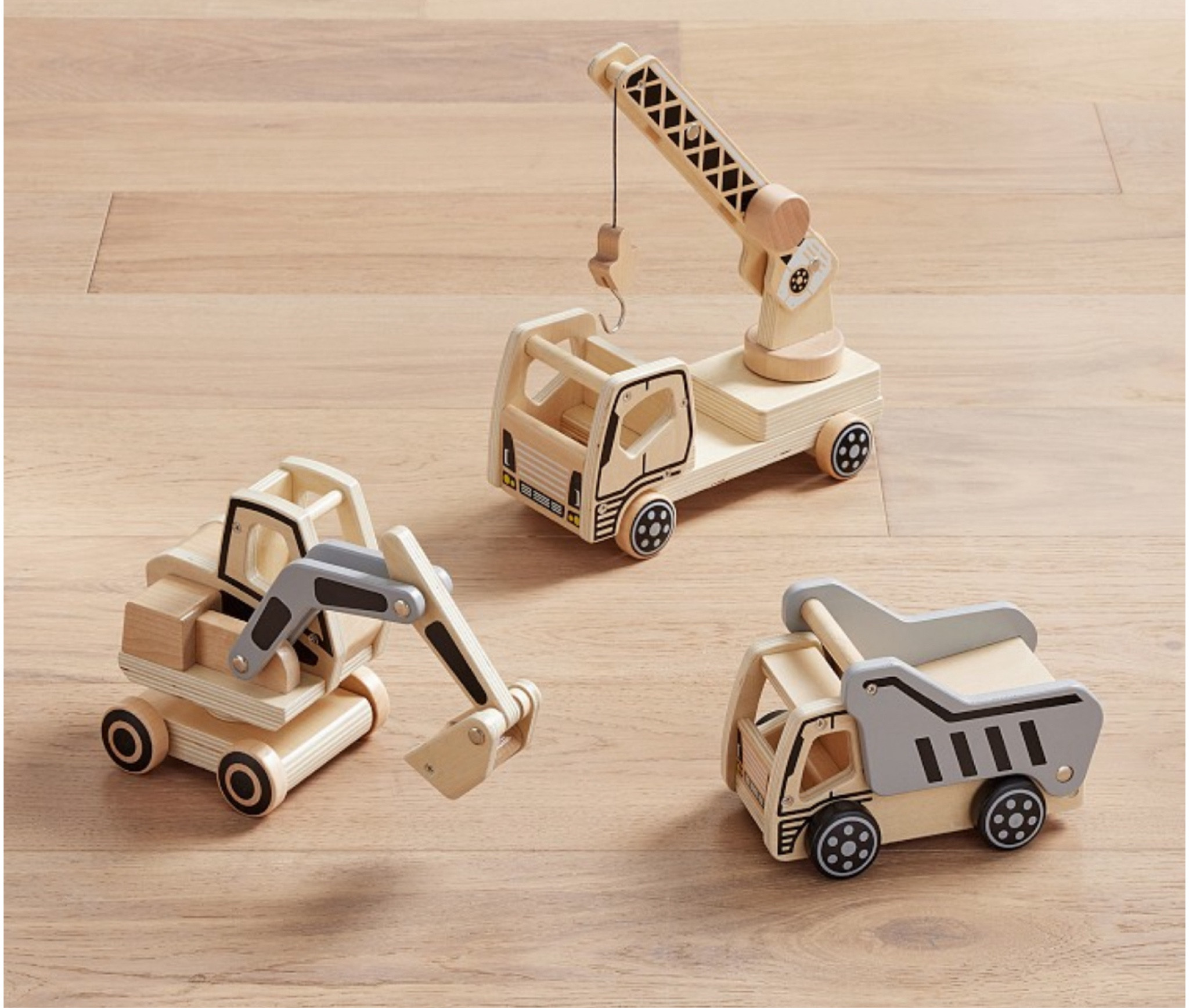 Budding builders will dig our trio of construction trucks. Featuring a truck, crane and bulldozer, the fun wooden designs are detailed with realistic accents, including a hook, cable and movable arm for hours of creative play at pretend work sites.

#LTKKids #LTKBaby #LTKHome