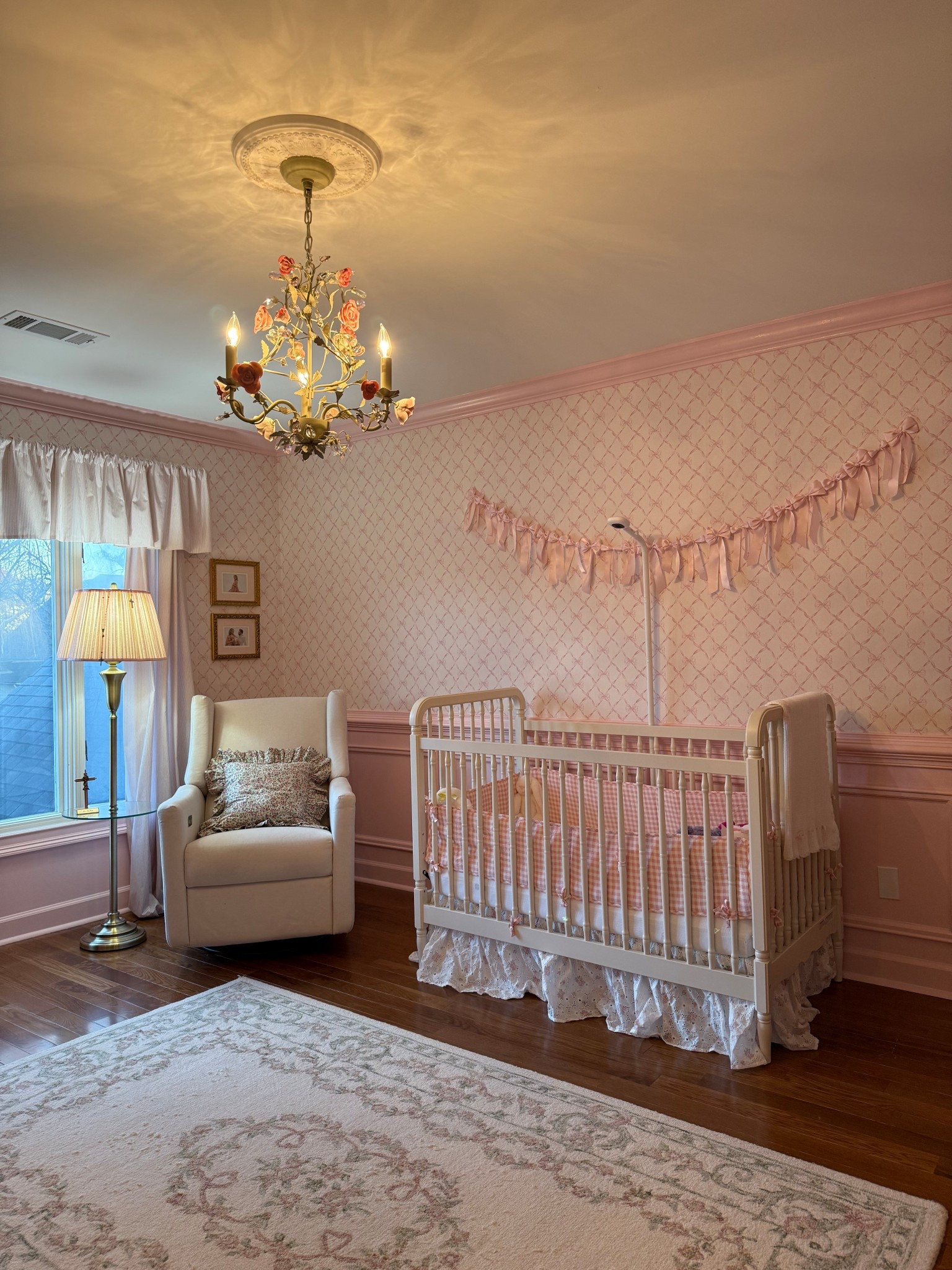 This nursery came together slowly and intentionally a mix of classic details, soft colors, and meaningful pieces that feel both sweet and timeless. I wanted the space to feel calm and comforting now, but designed in a way that she can grow into over the years.

From the brass bow sconces with pink shades to the antique artwork and cozy seating, every piece was chosen to add warmth, character, and a sense of tradition. This is my favorite way to design a child’s room: collected over time, never rushed, and filled with details that make it feel truly special.

#LTKmomlife #LTKBaby #LTKKids