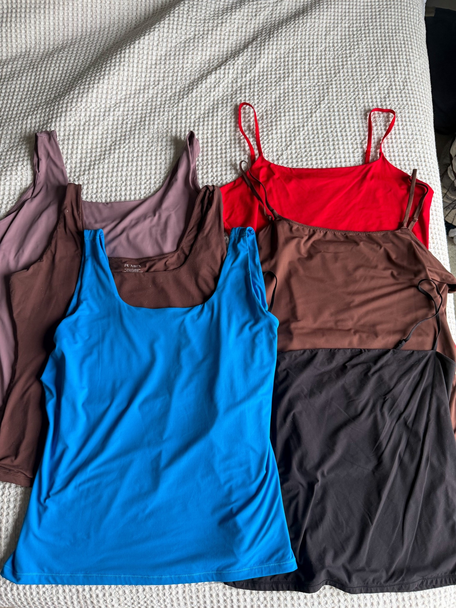 Laying single lined and double lined (better than skims) tank tops  these are one of my favorite layering pieces but really easy to pack or throw on with a cute pair of pants in the summer! I wear a size XL ￼
