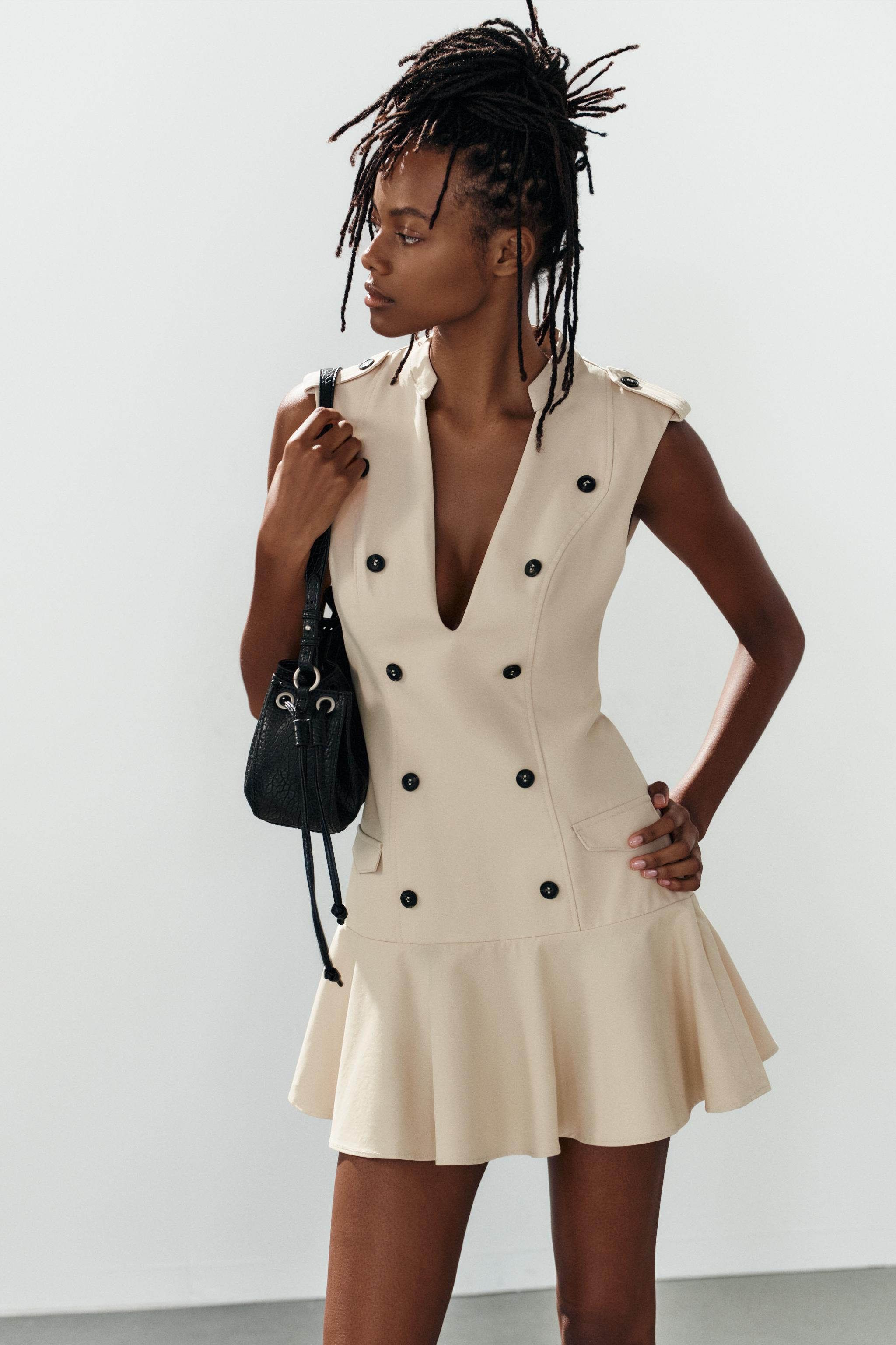 Sleeveless mini dress with a V-neck and tabs. Featuring faux flap pockets at the front, button de... | Zara UK