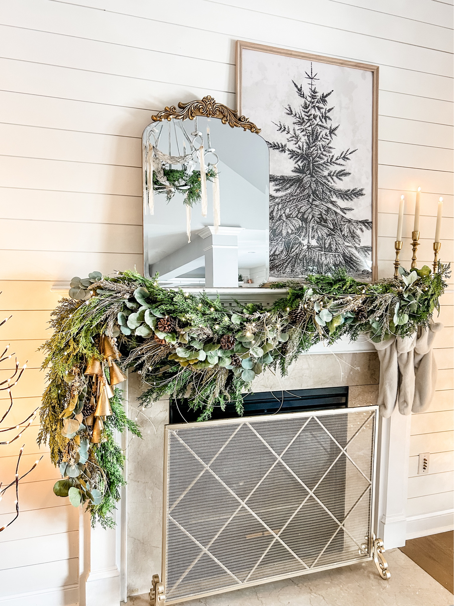 Our Holiday Mantel decor!! 

Gold fireplace screen, fire screen, arched mirror, Vintage Pine Print from Collection Prints, Natural poster frame,  27x40 frame, Target poster frame, gold taper candle holders, flamess taper candles in ivory, twinkle lights, string lights, fairy lights, eucalyptus Garland, Christmas mantel Garland.
Holiday Garland, neutral stocking. 
#amazon #target #christmas 

#LTKhome #LTKSeasonal #LTKHoliday