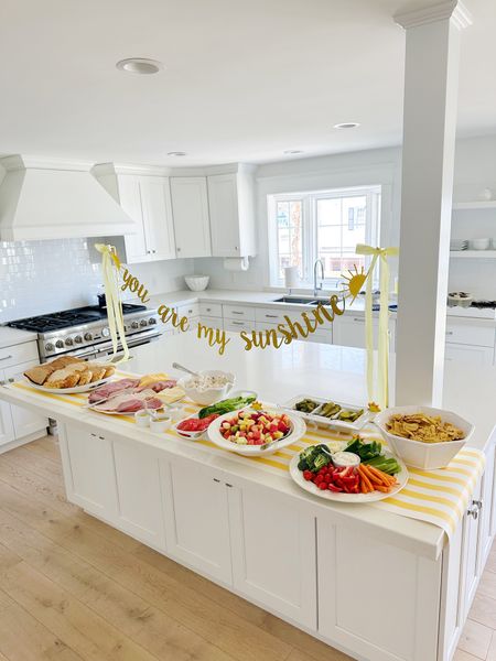 Kitchen island set up! Purse hangers are holding up the banner! This is a great party tip for any holiday!