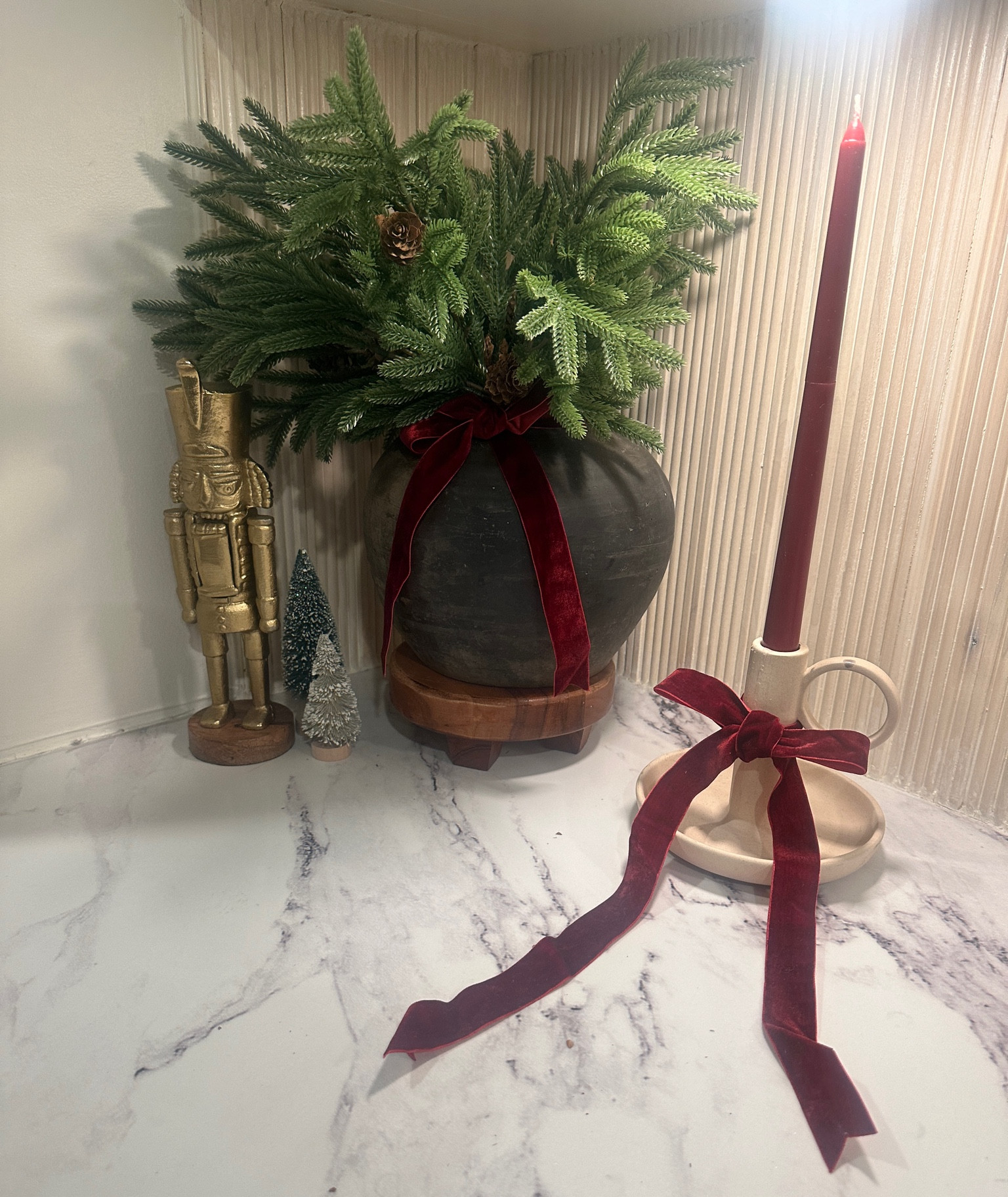 My holiday formula: Velvet ribbon, vintage ceramic vessel,
Brass decor, repeat.

#LTKHome #LTKSeasonal #LTKHoliday