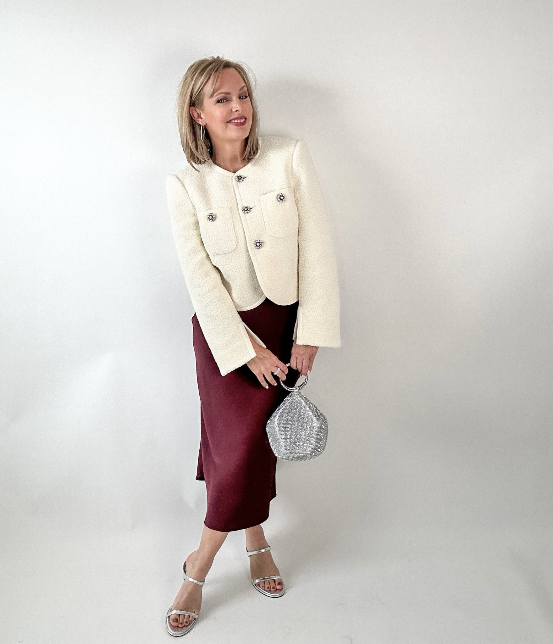 The lady jacket is getting a cozy upgrade for fall! Cut from exceptionally soft and luxurious teddy bouclé, this jacket has glistening rhinestone buttons to jazz up any outfit! TTS. I’m wearing a 4. The slip skirt is a size small, available in multiple colors and TTS. I’m wearing small. If between sizes,  size up. The metallic crystal mesh bag and strappy sandals finish the look. If you have narrow feet, skip the sandal.

#LTKItBag #LTKStyleTip #LTKHoliday