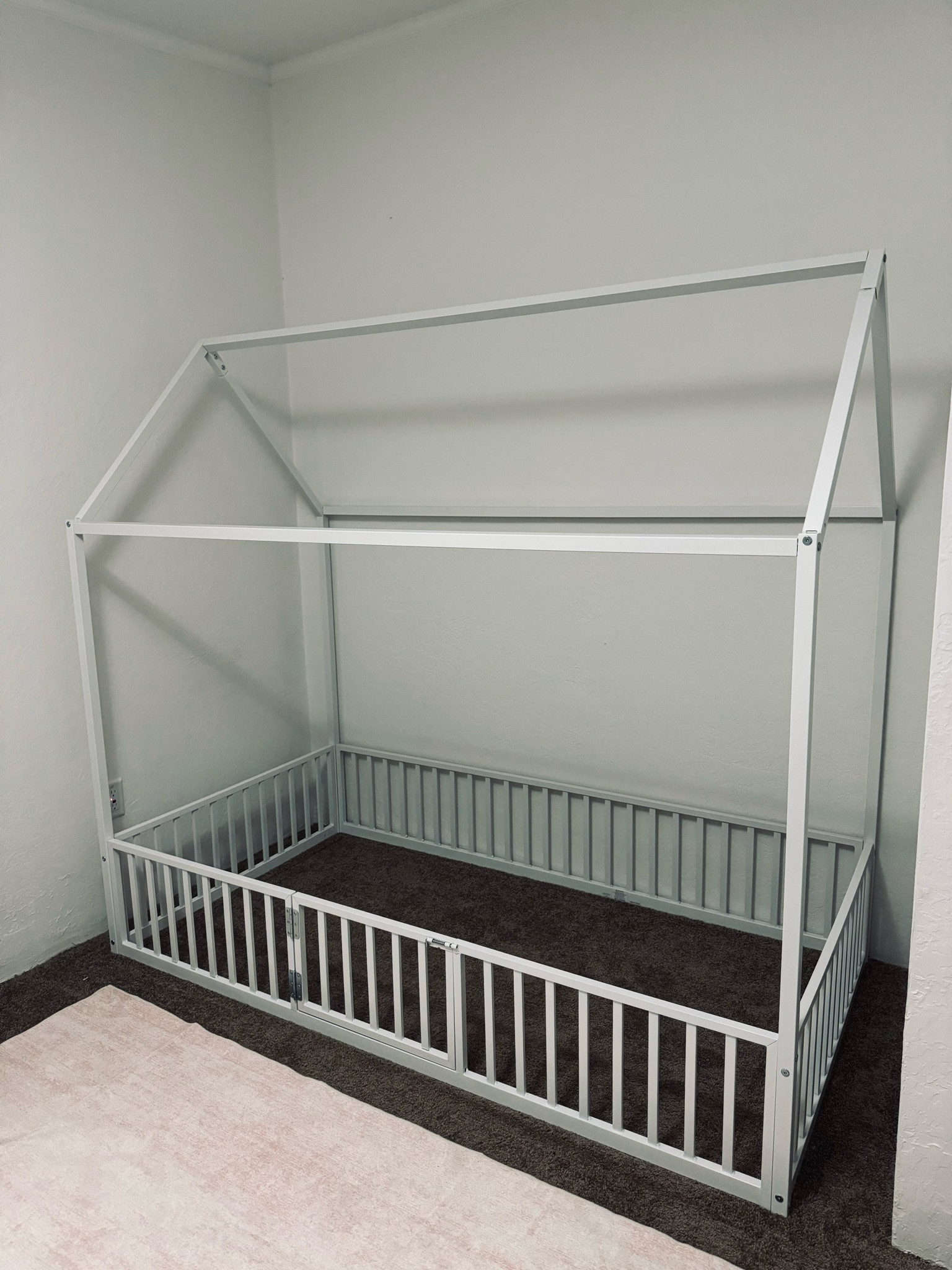 just got our big girl bed put together + waiting on our mattress 