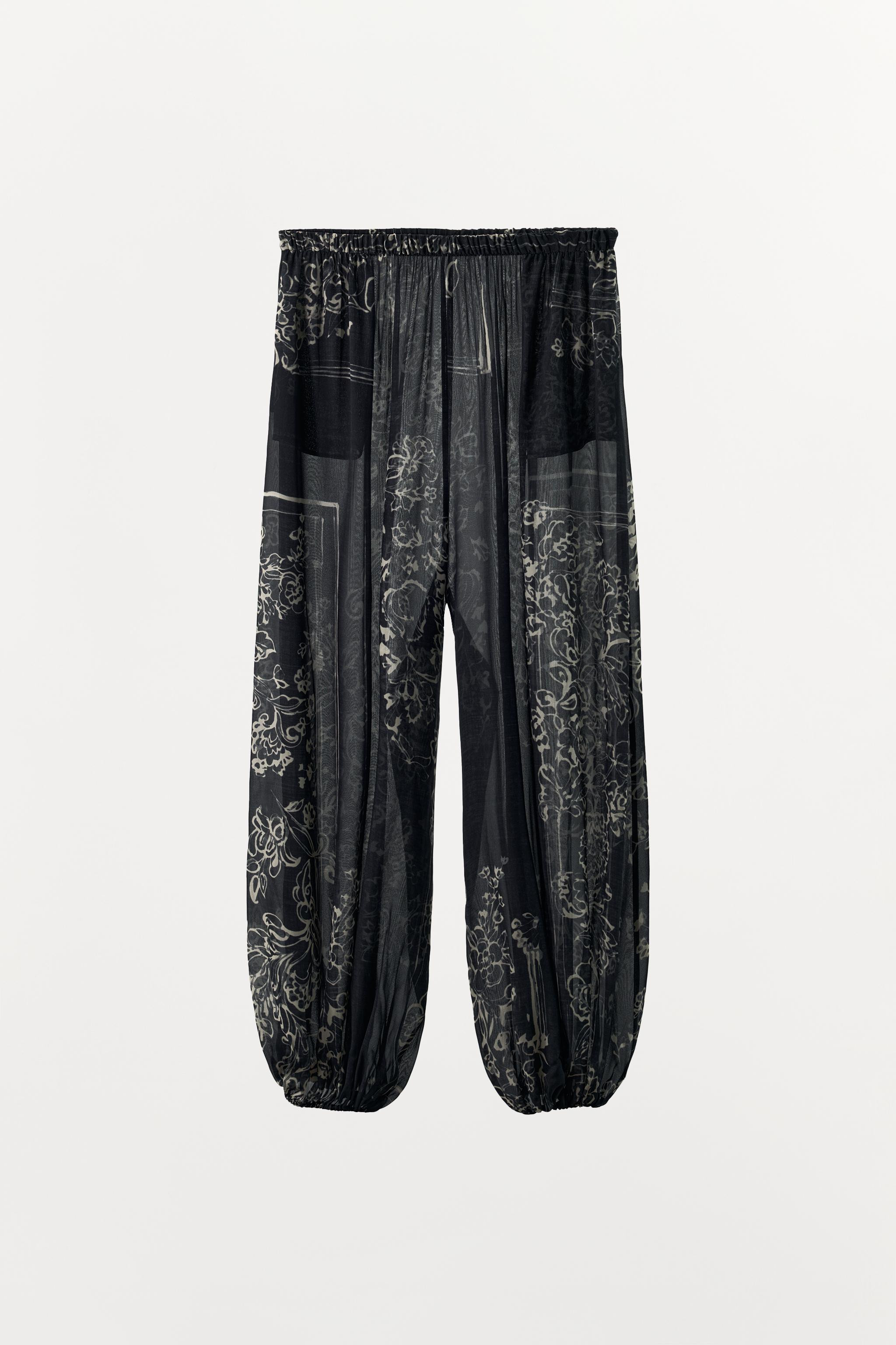 Model height: 167 cmSemi-sheer trousers with the main fabric made from 100% viscose yarn. Mid-wai... | Zara UK