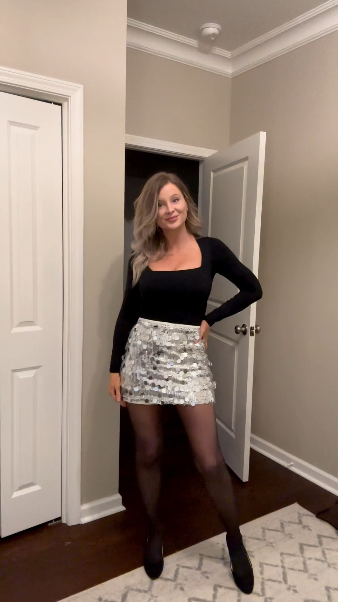 Holiday party outfit idea you can wear for Christmas party or New Year’s Eve.
Wearing a silver sequin skirt, black fitted long sleeve top, black sheer tights, and black heels.

This is an easy dressy holiday outfit, NYE outfit idea, and cocktail party look that works for winter events, dinners, and parties.
Perfect if you want a re-wearable holiday outfit and elevated black basics.

⸻



holiday party outfit
new year’s eve outfit
christmas party outfit
silver sequin skirt
black long sleeve top
sheer black tights
black heels
cocktail party outfit
winter party outfit
dressy outfit
evening outfit
holiday capsule wardrobe
minimal holiday outfit
women’s holiday fashion


#LTKootd #LTKHoliday #LTKFindsUnder50