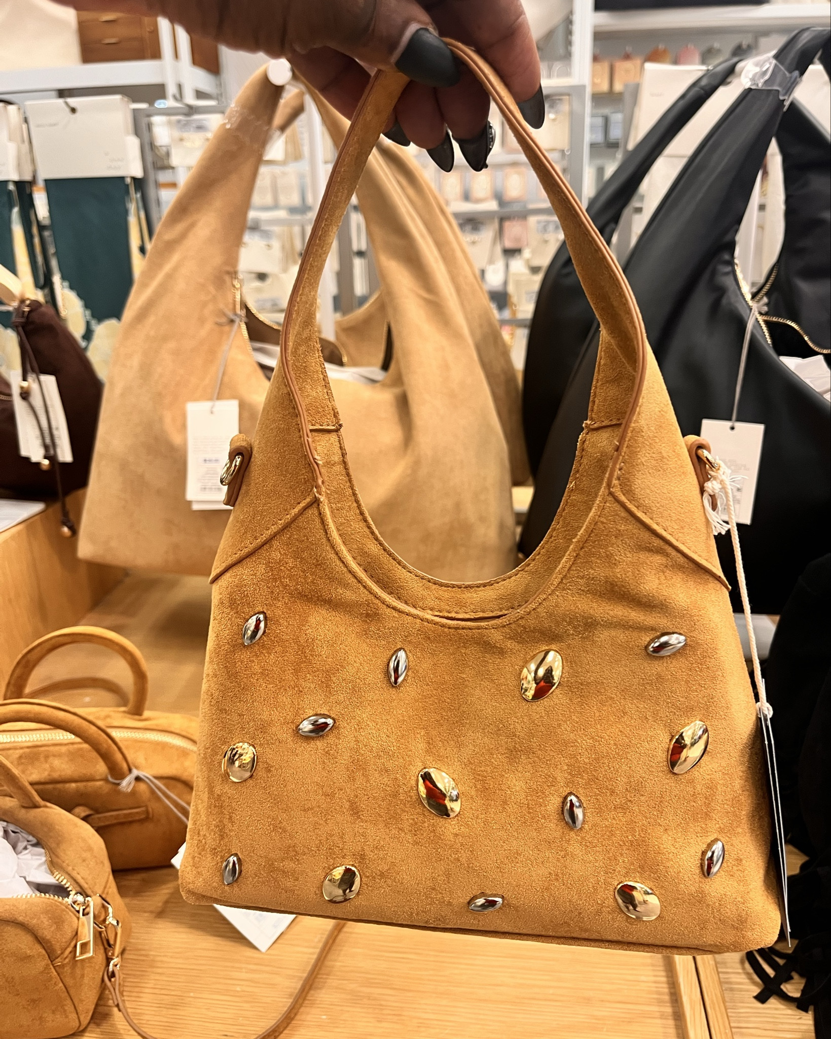 The mini faux suede studded purse at Target is so gorgeous!!! It comes in black as well that is more of a patchwork pattern! Both are beautiful! 

#LTKItBag #LTKStyleTip #LTKFindsUnder50