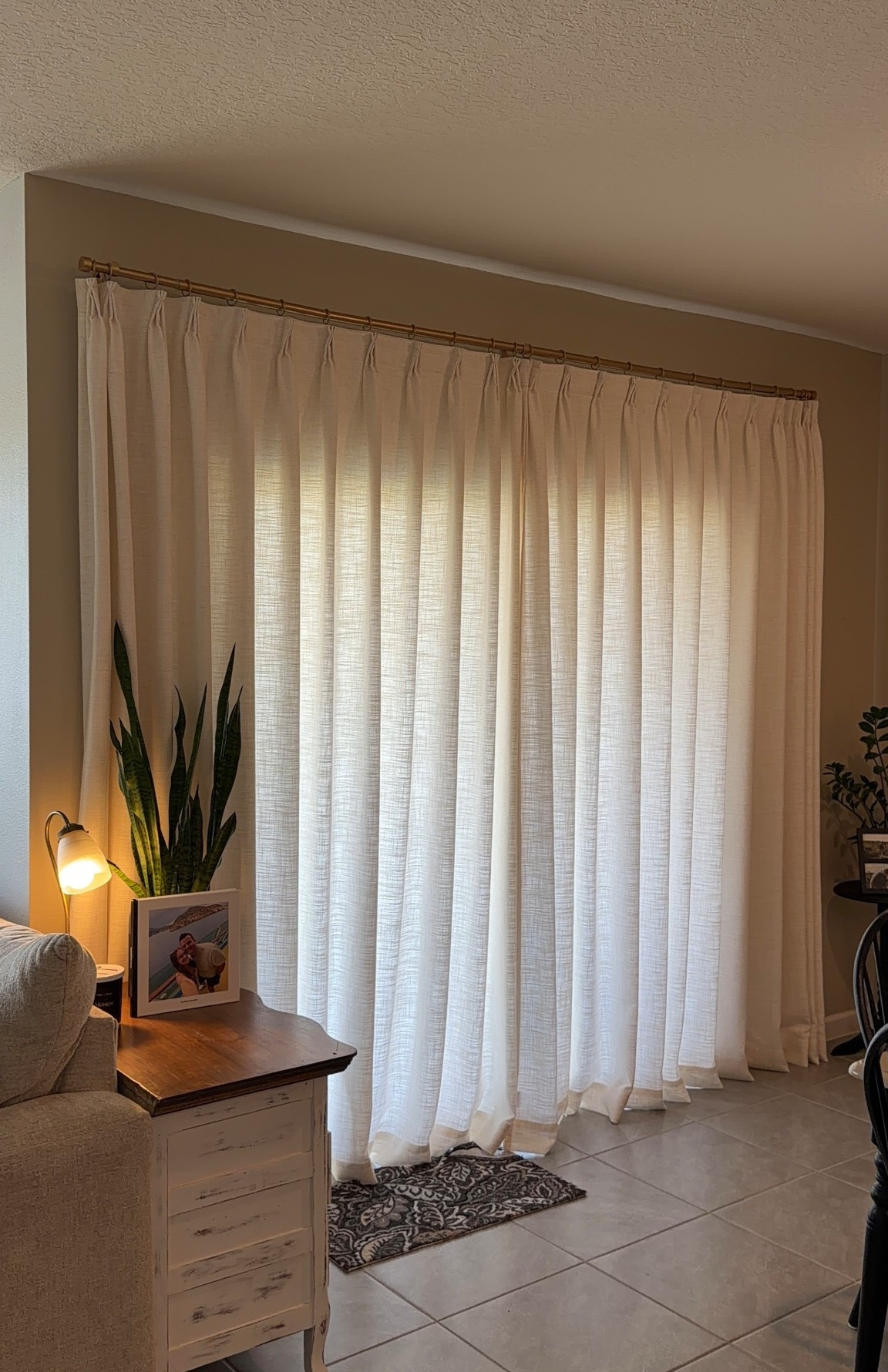 my dining room curtains 🪟✨
Liz Linen Drape Pleated Color: ivory white, lining type: 60% privacy, handing style: triple tailor pleat, dimensions: 93 x 60 inches per panel 
Jaylon Adjustabke Curtain Rod with Rings, color: gold, size: large 28-140 inches

#LTKHome