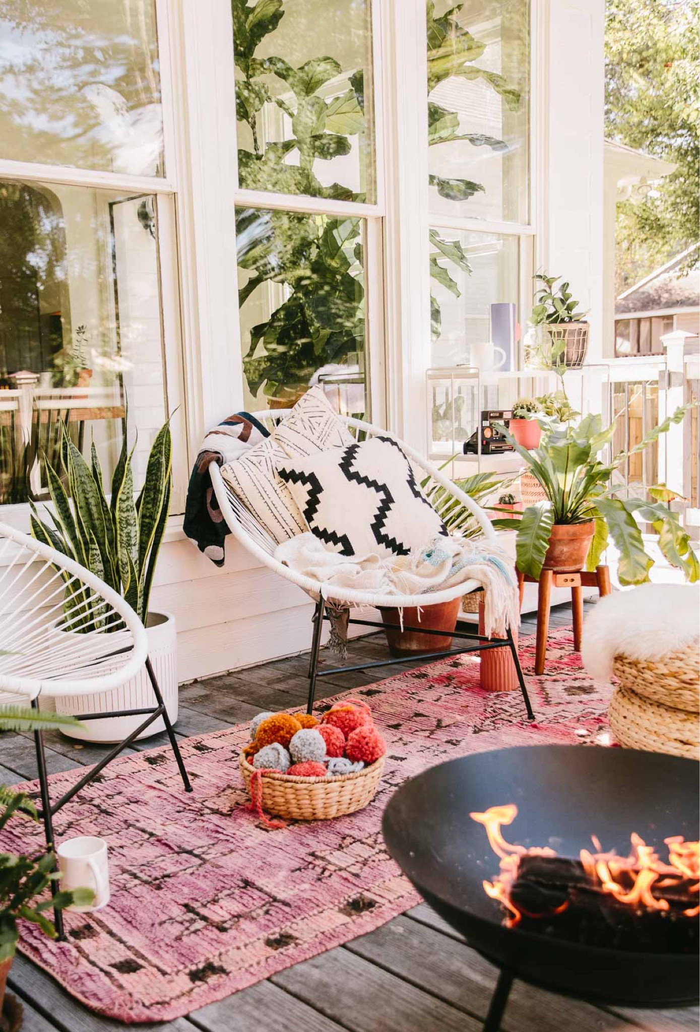 Summertime vibes - I am doing as much outdoor entertaining this year as possible. And I’ve had these outdoor chairs for 5 or 6 years now. They’ve held up really well and still look stylish imo. I’ve pressure washed them a couple of times just to refresh them, but other than that, no upkeep. Outdoor furniture - outdoor chairs - lounge - fire pit - outdoor rug - planters - eclectic - boho - mid century 

#LTKSeasonal #LTKstyletip #LTKhome