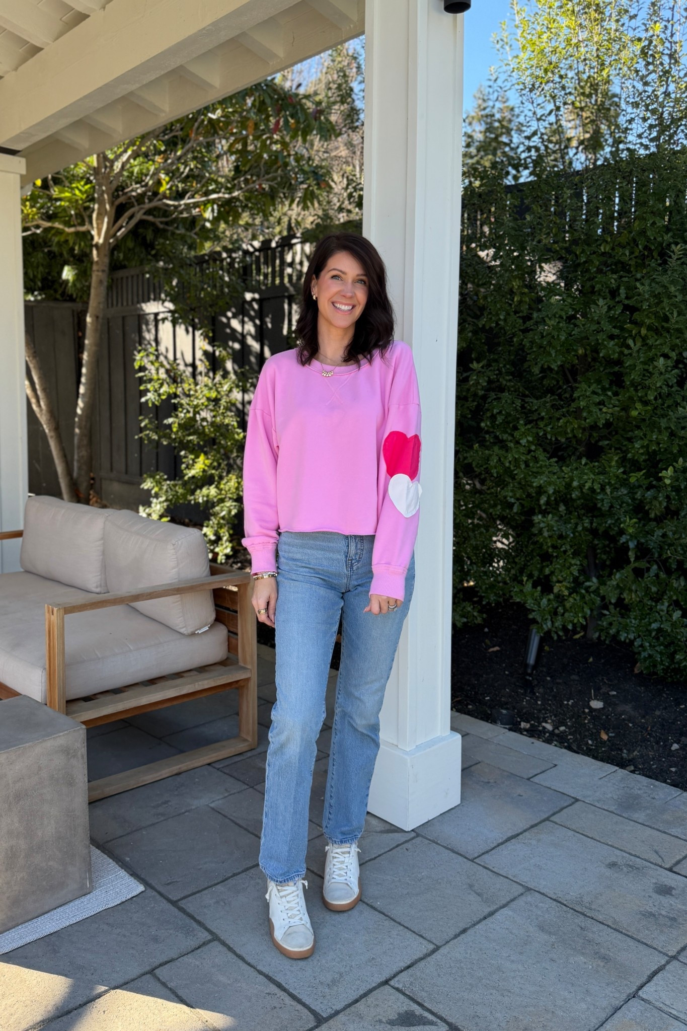 A cuties valentines sweater. I grabbed this in a small. The sweatpants that go with it are available in very few sizes. I’m keeping an eye on it because I want them! 
These jeans are a favorite. I always reach for them. Wearing a size 26 (I usually size down in this brand). 
Shoes are older. I tend to size up half a size in this brand  

#LTKvlog #LTKmomlife #LTKootd