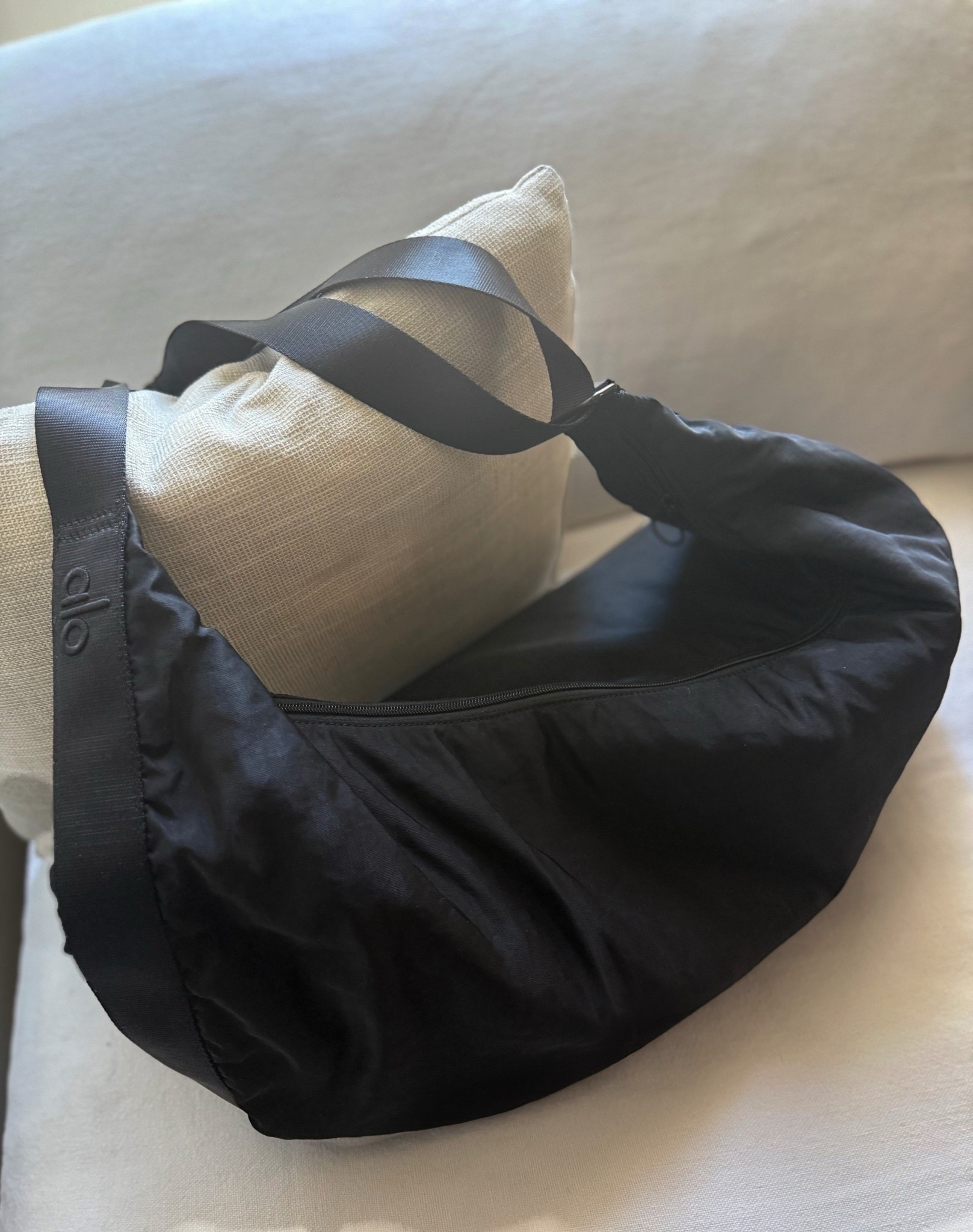Current travel bag from Alo last year, sadly this one is discontinued but I linked a few crescent shaped slouchy bag options below. This is probably a gym, but it  doesn’t pull down on my shoulder and is oerfect when I travel. 

#LTKActive #LTKSaleAlert #LTKTravel