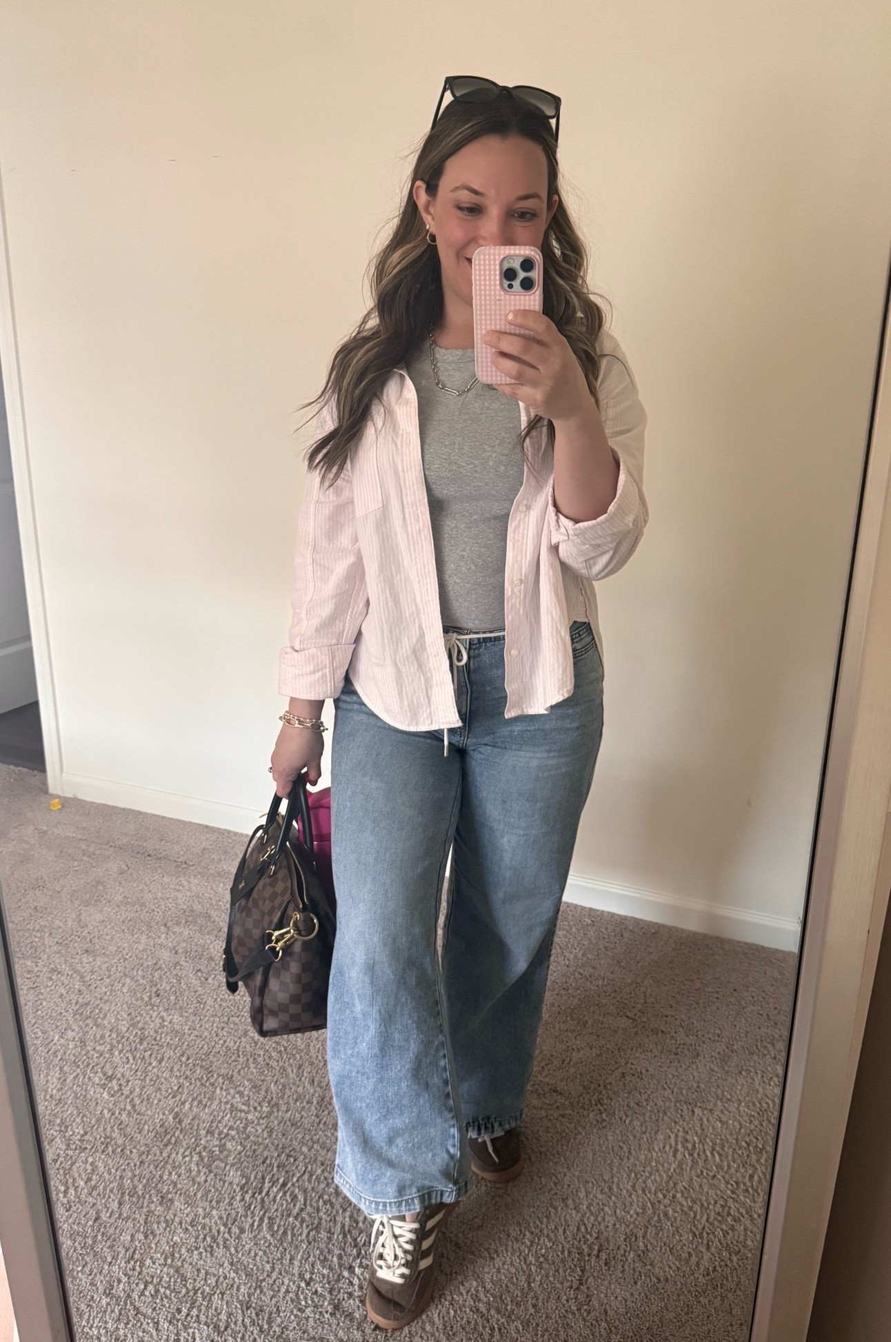 Spring 2026 outfit laid back casual millennial style pink and white stripe button up wide leg jeans brown sneakers grey cropped tee

Cute casual outfit this Mother’s Day 💕💐
My button up and jeans are no longer linkable but I found some very similar styles! 
Tee - Medium
Sneakers - 7 sized down 1 size 

As always, thank you for shopping from my links and supporting what I love to do 🥰😘

#LTKootd #LTKselfcare #LTKdayinmylife