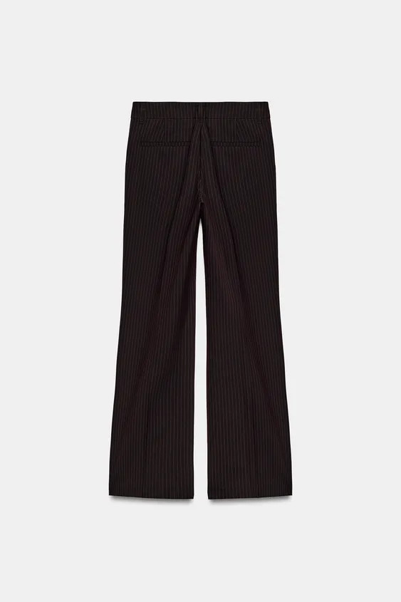 Low-rise pants with belt loops. Side pockets and false back welt pockets. Ironed pleat detail on ... | Zara US