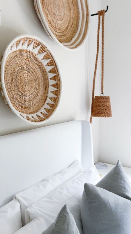 BEACH HOUSE BEDROOM - A look at one of the Hola Beaches Casita bedrooms! I decorated with this designer look-for-less white upholstered bed, white bamboo nightstands, light blue linen pillow, basket art set, rope pendant lights, and a striped jute rug! See more pics and the full home tour here: https://lifeonvirginiastreet.com/hola-beaches-casita-30a-tour/.
.
#ltkhome #ltksalealert #ltkstyletip #ltkfindsunder100 #ltkfindsunder50 #ltkseasonal beach house decor, beach house bedroom, 30A decor 

#LTKVideo #LTKSaleAlert #LTKHome