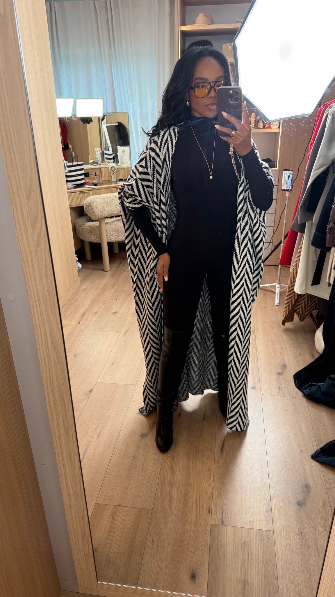 Polished layers with an edge — this is how I’m styling a fitted black base when I want warmth, shape, and contrast without overthinking it. The long patterned layer adds movement while the black underneath keeps everything grounded and wearable.

Perfect for coffee runs, casual meetings, travel days, or a chic everyday look.

Tap to get details and recreate this outfit.

📏 Sizing & fit details:  
Wearing size Small  
Height: 5’4”  
Bust: 34D  
Waist: 27”  
Hips: 40”  
Jeans and pants fit reference: 27 Long / 4 Long  

This look works because the fitted base balances the dramatic outer layer, making it easy to style with boots now and lighter shoes later. Pieces like this are great building blocks you can rewear all season, styled multiple ways so the cost per wear keeps dropping.

Neutral layered outfit ideas, black base outfit styling, winter layering inspiration, everyday chic outfits, versatile capsule wardrobe pieces, long coat styling, wide-leg pant alternatives, modern casual looks.

Follow me on Instagram and YouTube @kirasfashionfinds

#LTKootd #LTKPetite #LTKgrwm