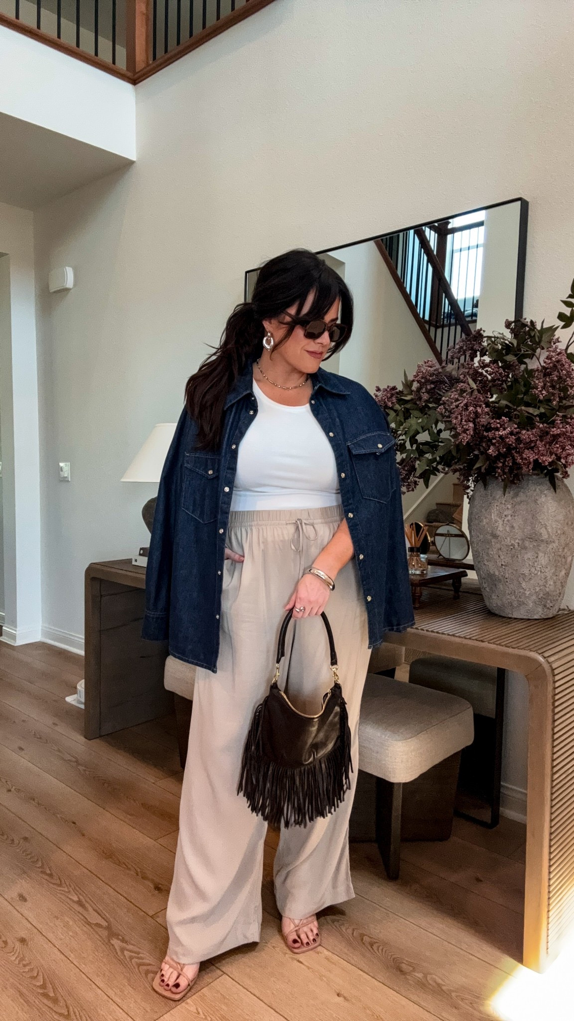 Laid-back layers with a little edge 🤎
I’ll never get tired of a classic white tank + wide leg pant combo—just added a denim layer and fringe bag to give it some personality.

#LTKMidsize #LTKStyleTip #LTKSummerEdit
