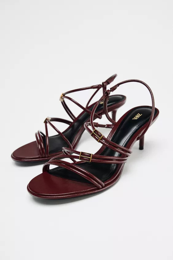 Heeled sandals. Multiple straps on the front with metal appliqués. Fastens with an elasticated b... | Zara UK