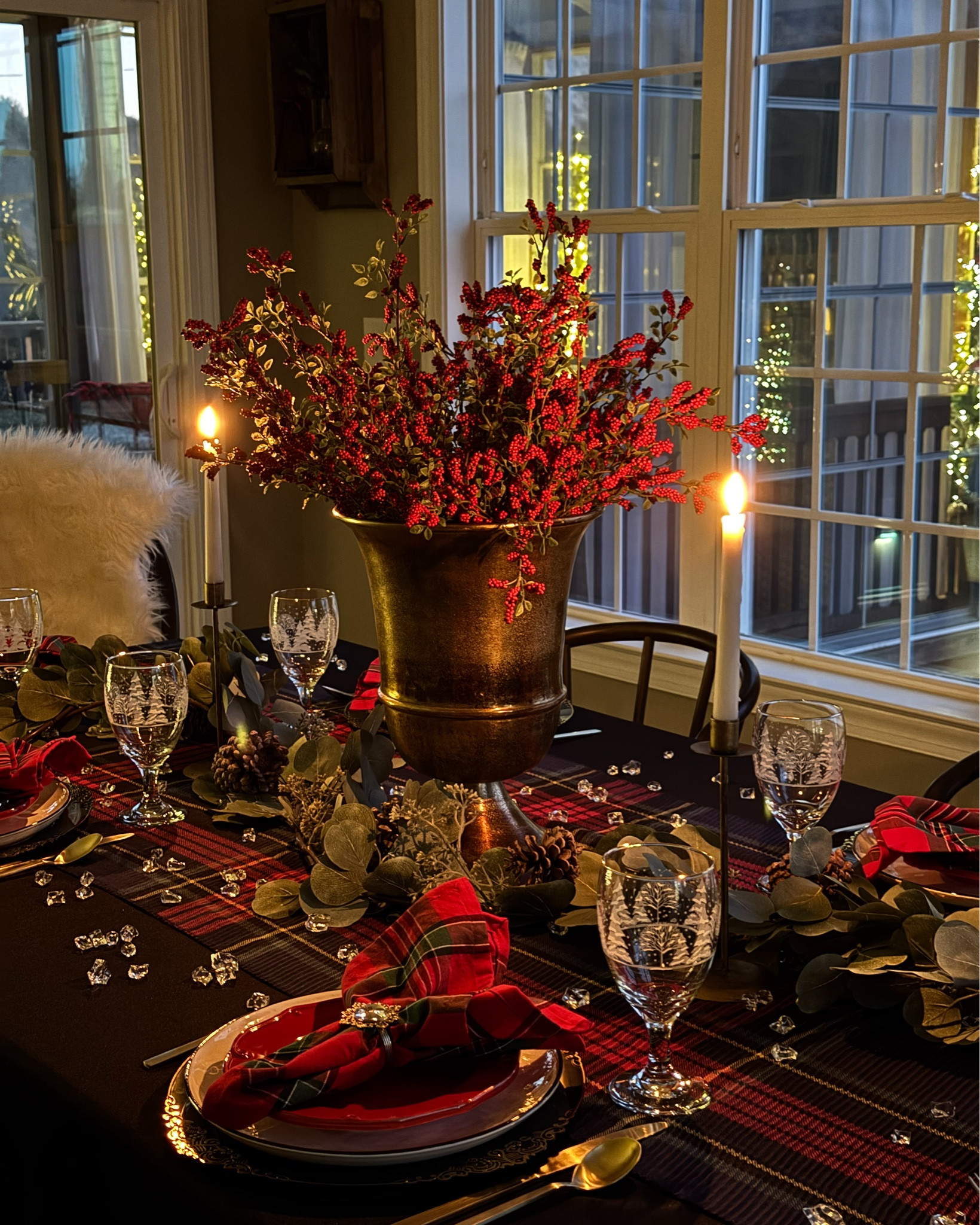 
My Christmas 2025 tablescape at nighttime!! I just love the magical glow😍
I used one of my plaid scarves as a table runner. A few of my pieces I've had for several years. I've found a few exact pieces and some similar to mine. My bronze urn is the 11". It's absolutely gorgeous
Dinnerware, bronze urn, berry stems, acrylic ice, black tablecloth, plaid scarves, dining chairs, red salad plates, frosted tree goblets, rhinestone napkin rings, velvet ribbon, chargers, gold taper candleholders, eucalyptus garland, faux fur
