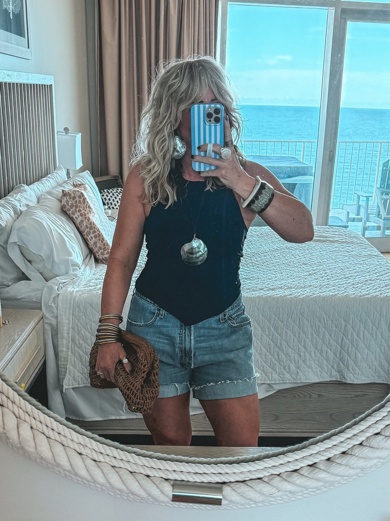 Obsessed with this halter top! Need another color! I’m wearing a medium and it’s double lined up top so no bra! 🙌🏼 Also I’m wearing my hubby’s old Levi’s jeans that I cut off into shorts. Love them and so comfy! I sized up like 4 sizes to get this baggy fit.

#LTKOver40 #LTKootd #LTKgrwm