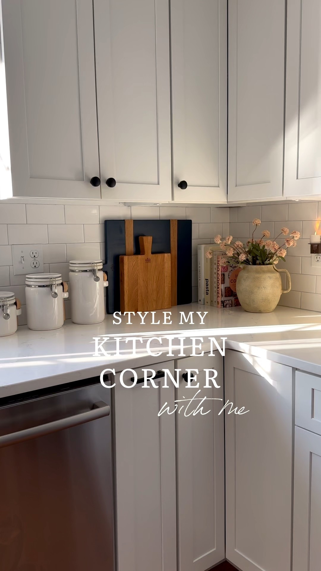 Kitchen counter styling with textured ceramic pitcher vase, soft blush florals, stacked cookbooks, and white subway tile backsplash. Warm neutral kitchen decor for a simple seasonal refresh. 
kitchen counter decor, ceramic pitcher vase, spring kitchen decor, cookbooks styling, subway tile kitchen, neutral kitchen, blush florals, kitchen styling ideas, coastal kitchen decor, simple home refresh, cottage kitchen, everyday decor, sherri calnan home

#LTKHome