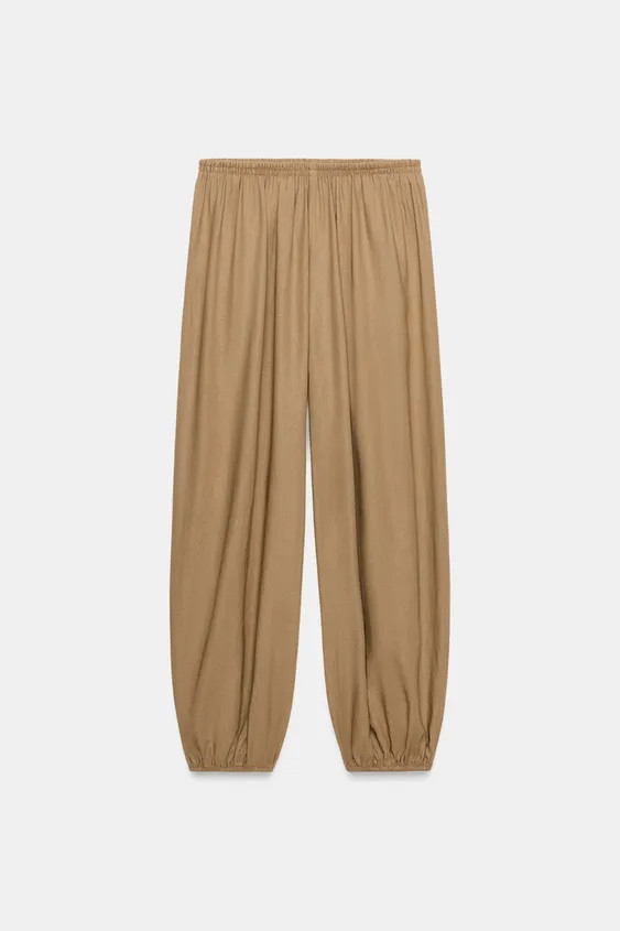 Model height: 177 cmTrousers made from a linen blend. Featuring a mid-waist with an elastic waist... | Zara UK