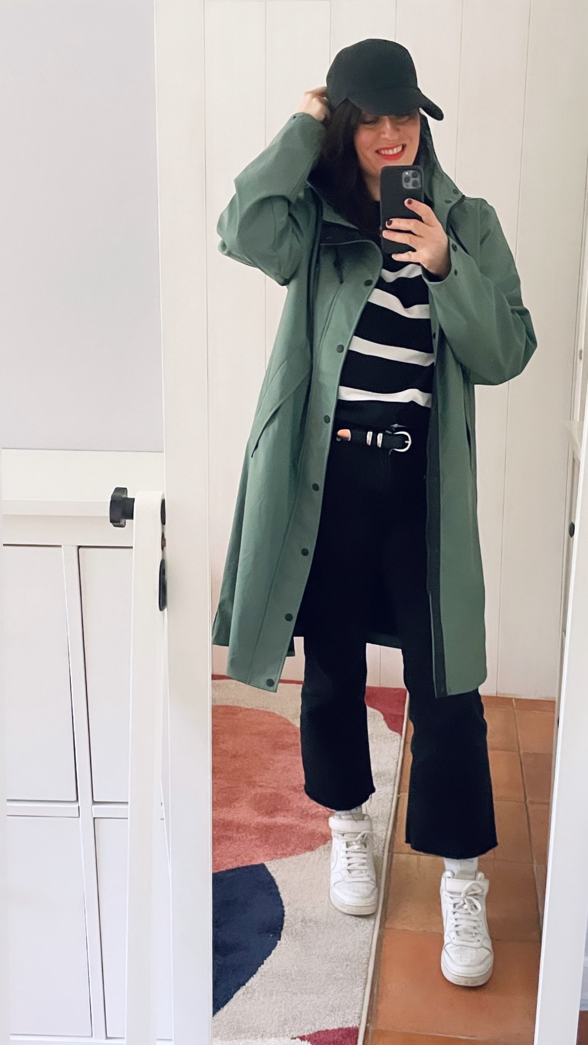 • Black baseball cap #ca (similar, linked)
• Green "Jayce X" raincoat #americatoday
• Black and white striped sweat-shirt #hm (similar, linked)
• Black leather "western" belt #zaraman (similar, linked)
• Black flare crop "Sienna" jeans #mango (linked)
• Pinky red lipstick "Palette visage multi-usages" #rouje 

#LTKmidsize #LTKover40 #LTKeurope
