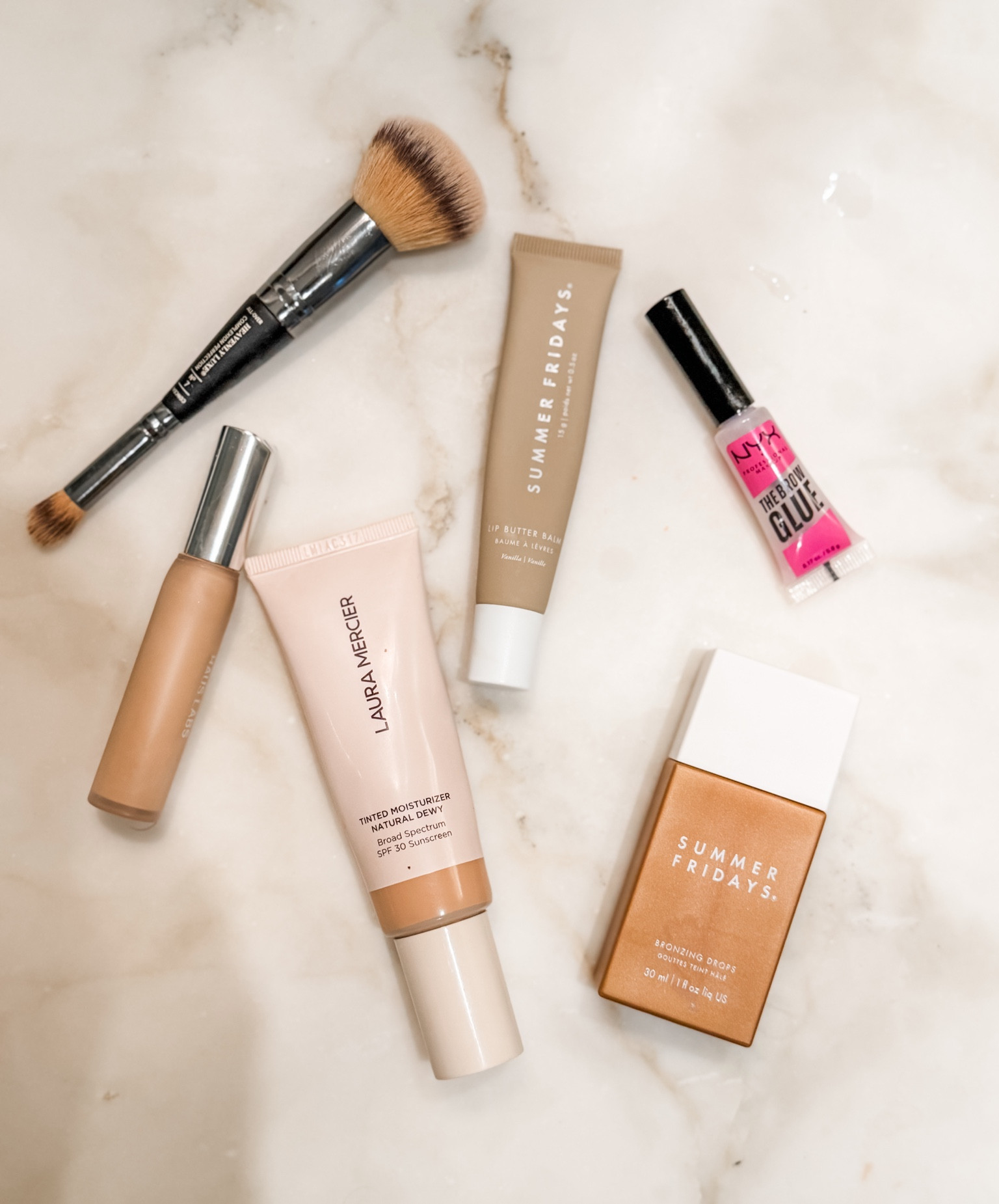 My everyday face 🤍 The Summer Fridays jet lag mask, the vitamin C eye cream, the bronzing drops, and the lip butter balm — plus the Laura Mercier tinted moisturizer and NARS concealer I have used for years. 

 #everydaymakeup #beautyfinds