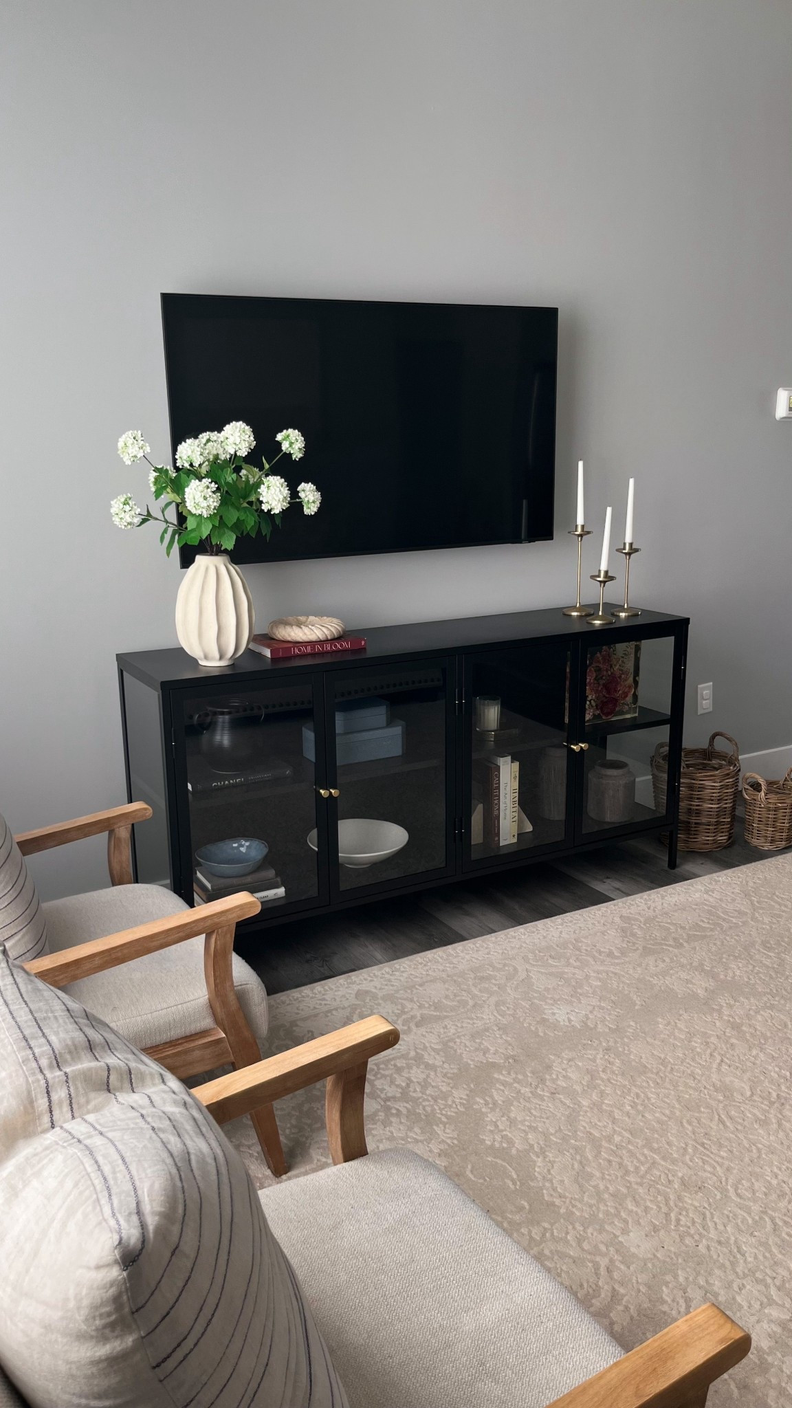 Console table spring refresh 🌸🍃✨ Faux silk hydrangea floral stems, wavy vase is old from Target (linking other similar styles!), Home in Bloom book, Studio McGee twisted edge cream marble dish, travertine stone book ends, other decorative home decor books, decorative boxes, candlesticks and candle stick holders, black and glass console table.

Spring home decor,
Console table styling,
Spring refresh

#LTKSeasonal #LTKHome #LTKselfcare