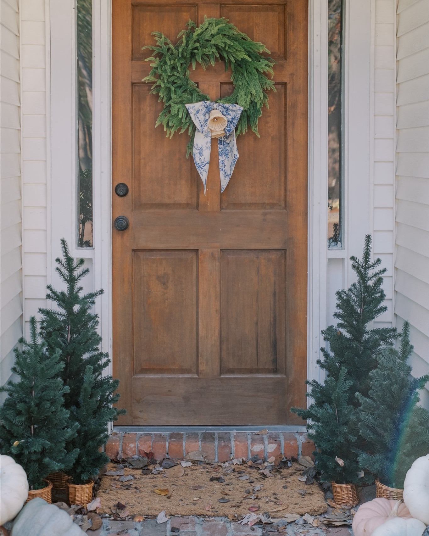 Sharing a simple, quiet luxury front door Christmas inspiration. These faux pine Christmas trees by Studio McGee caught my eye when they were first released and I’ve been so in love with them! They were a little bit of an investment, but will last future Christmas decorating! I am very impressed with the quality. 

Also, I don’t know about you, but I’ve always wanted to design my own Christmas wreath and this year I did! The bow is so on brand for MKS and makes such a statement!

#LTKHome #LTKHoliday #LTKSeasonal