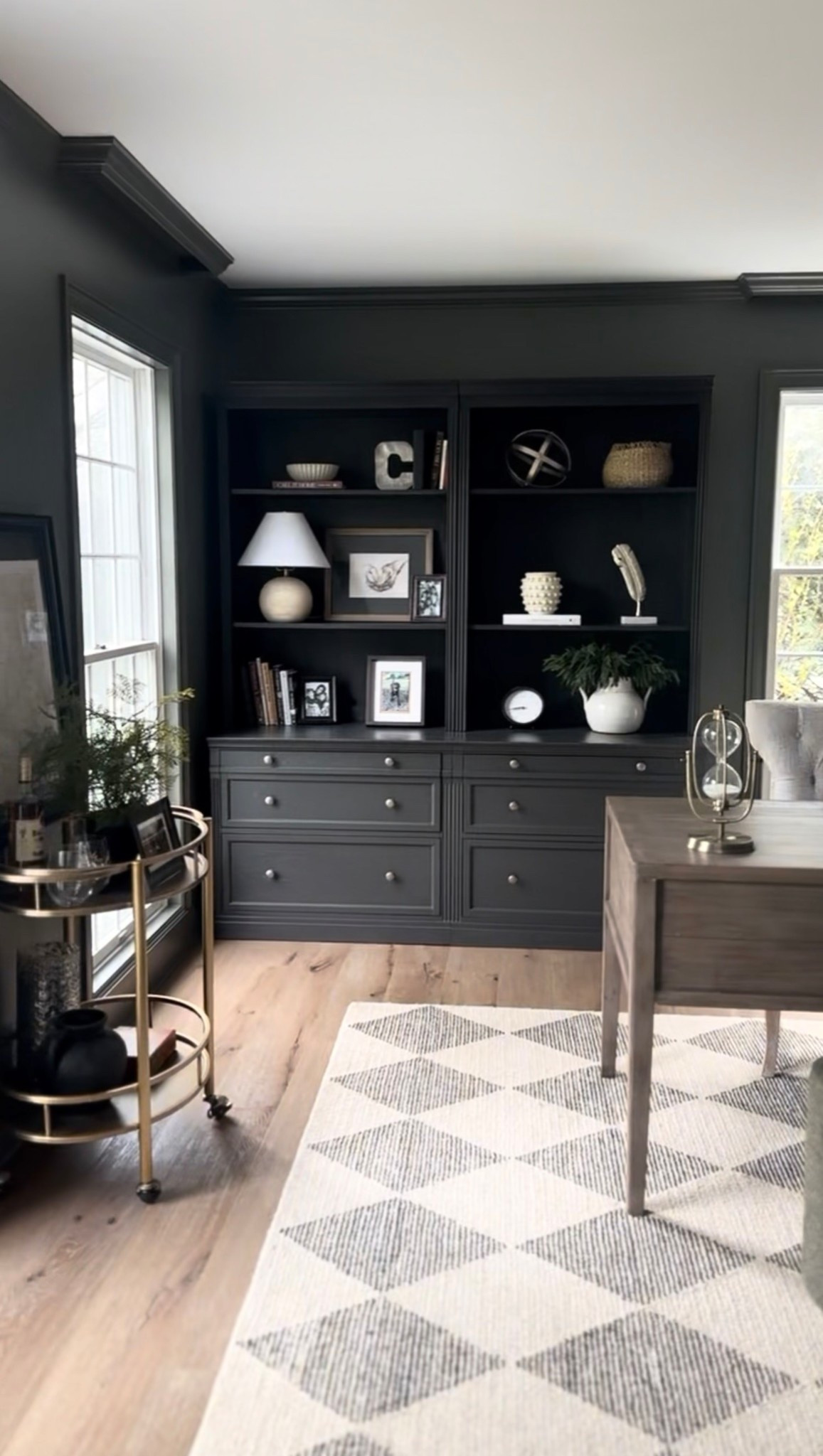 Shop this beautiful, traditional, sophisticated Livingston filing drawers/book case modular set from Pottery Barn. Mine is in the Dusty Charcoal finish. I also included the checkered rug, bar cart, and a few other accessories⏳

#LTKHome