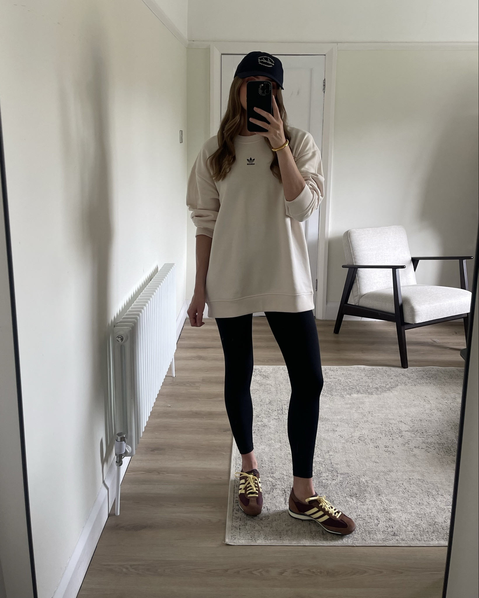 ad. Styling the Adidas SL 72 OG trainers

Wearing a small in the cream oversized sweatshirt, this runs very oversized so I would order your normal size 
Navy Adidas cap 
Black leggings 
Adidas Originals SL 72 trainers in maroon/brown and yellow 
