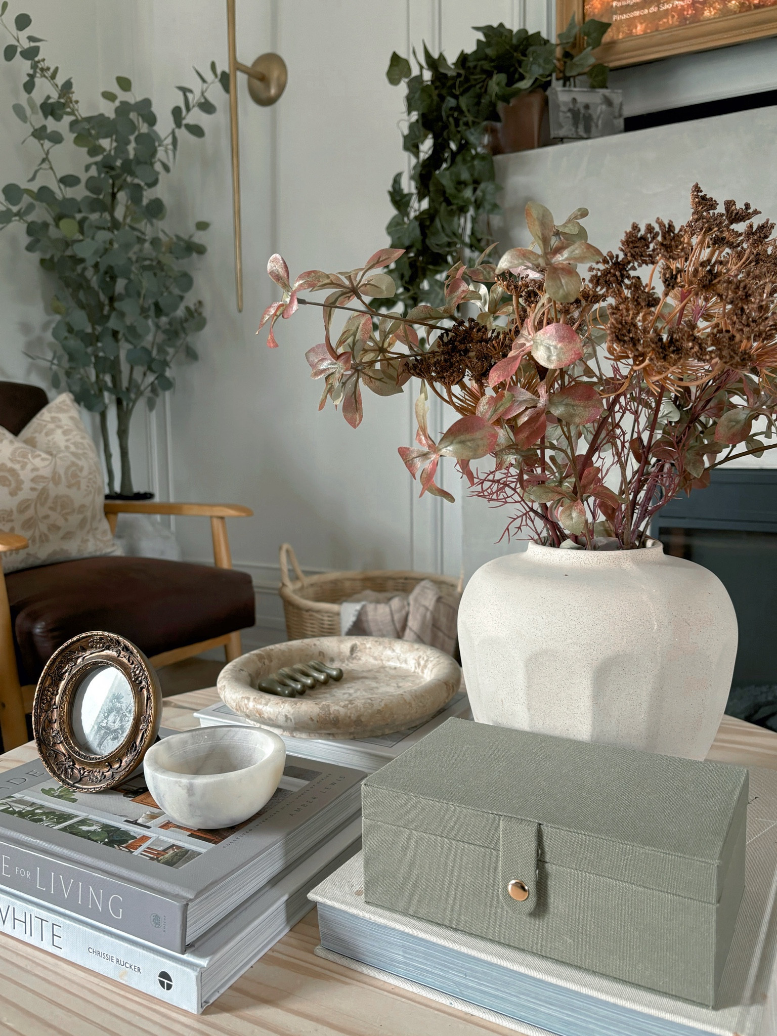 Transitioning the coffee table decor from Summer to Fall. Change out for some warmer tones and change your floral stems out for some fall stems. 

#LTKHome #LTKStyleTip #LTKSeasonal