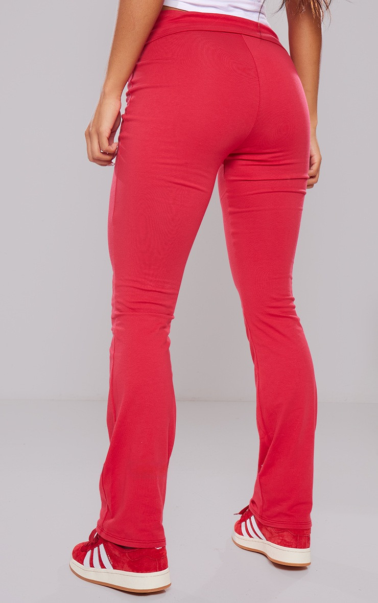 Cherry Red Cotton Fold Over Waist Flare Trousers | PrettyLittleThing UK