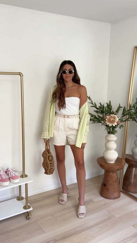 spring outfit ideas: white trouser shorts (26) strapless tube top (small) and oversized striped button up (medium) paired with a platform sandal 

Summer outfits | spring outfits | elevated outfits | Abercrombie style | trouser shorts | shorts outfit 

#LTKVideo #LTKFindsUnder100 #LTKStyleTip