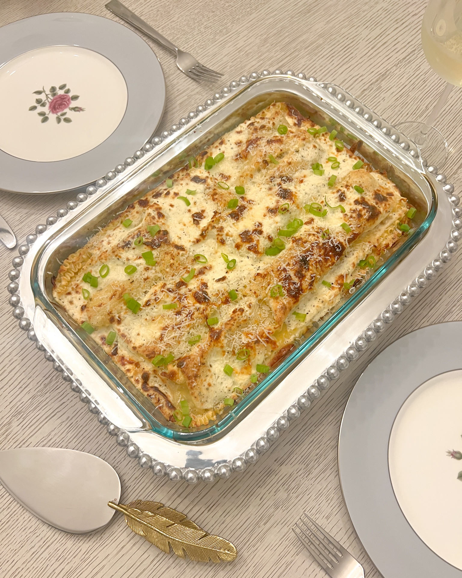 Silver pearled casserole dish server that elevates the oven safe dish off the table. Serving pieces, oven to table, silver, Mariposa, gold feather, server, cake knife, gold. Grandmillennial, classic, traditional, vintage finds

#LTKSeasonal #LTKparties #LTKhome