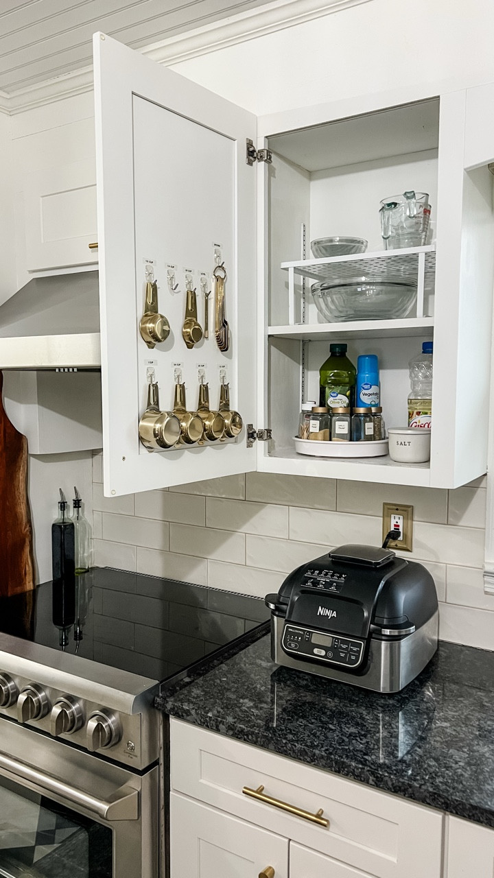 Day 3 of my slow and simple kitchen reorganization project! This cabinet has a random mix of bowls, measuring cups, oils, and spices, and it usually gets cluttered quickly.

I simplified the things I keep in it and moved all the extra oils, vinegars, and spices to the pantry.

And I’m tired of constantly lugging my air fryer in and out of a cabinet so I’m trying out just leaving it on the counter all the time. It does take up a lot of counter space but I use it at least 5 times a week so it seems justified.

Frequent air fryer users: do you keep yours out or put it away?

#kitchenorganization #organizedhome #homeorganization