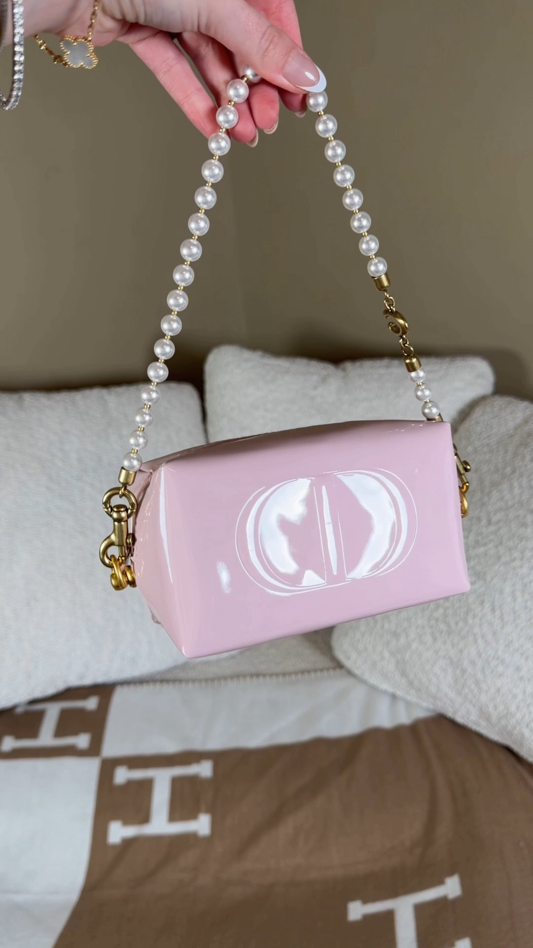 Fun lil Dior makeup pouch diy 💗 Comment SHOP & I’ll dm you the links 💗

I ordered this cute Dior beauty set that comes with a volume mascara, a color-reviving hydrating lip balm and a mini plumping lip gloss in a Dior makeup bag with the CD initials.

I added these little loops onto the sides and a coach pearl strap 💗

 Diorshow Overvolume, 090 Overblack, 10 ml. The Dior mascara that combines a 440%¹ extreme volume boost with lash-by-lash definition. Intensely pigmented, it coats the lashes in a longwearing, no-transfer deep shade of black.

- Dior Addict Lip Glow, 001 Pink, 3.2 g. Combining makeup and lip care, this lip balm reacts to the lips' pH to reveal a custom color that instantly enhances their glow. Its formula is infused with cherry extract and shea butter to leave lips hydrated for 48 hours,² as well as soothed, and looking visibly smoother and plumper.

- Mini Dior Addict Lip Maximizer, 001 Pink, 2 ml. A miniature version of the maxi-volume effect plumping and hydrating lip gloss by Dior. Slip it into your bag for instant touch-ups, wherever you are.

#LTKBeauty