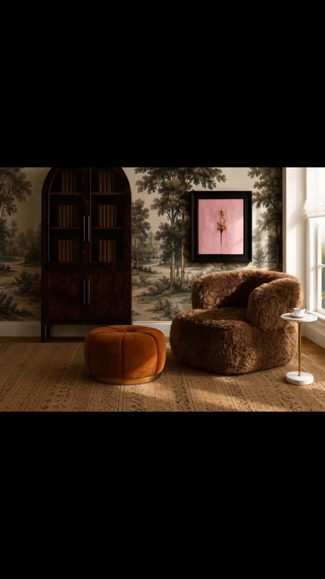 A quiet morning coffee moment surrounded by warmth and texture. ☕️🤎

The scenic mural creates such a beautiful backdrop, layered with the arched bookcase, pink artwork, cozy lounge chair, marble side table, sculptural ottoman, hand-knotted rug, and softly filtered morning light through the Roman shade.

Warm, collected, and inviting—the perfect corner to enjoy that first cup of coffee.

#MorningCoffee #MorningMoment #LoungeChair #Ottoman #SideTable #HandKnottedRug #RomanShade #WallMural #Bookcase #WallArt #ReadingNook #InteriorDesign #HomeDecor #LTKHome

#LTKdayinmylife #LTKHome #LTKSaleAlert