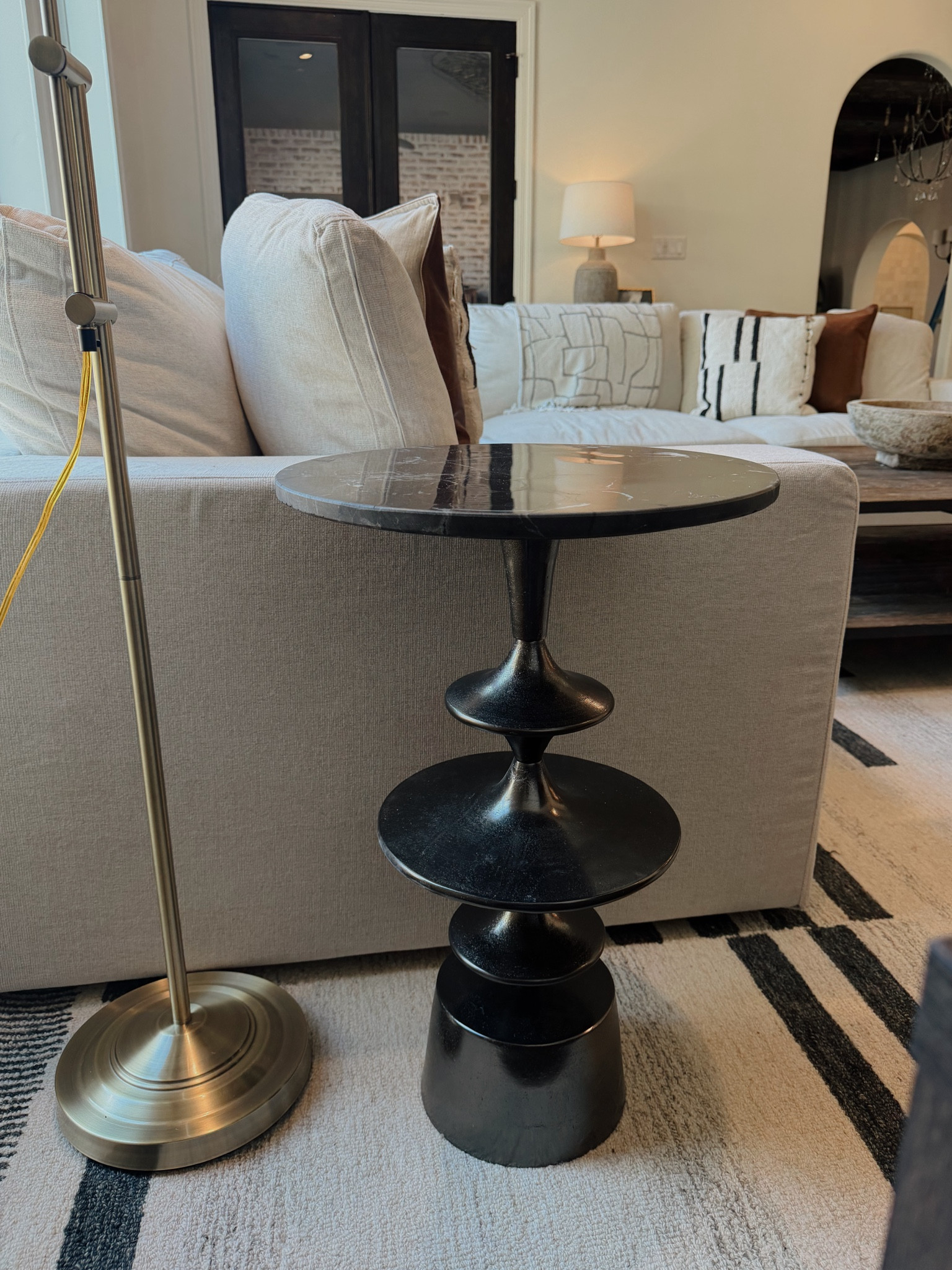 A small accent table that makes a big difference. This sculptural side table is perfect next to a sofa or chair—great for a drink, book, or lamp without taking up much space. I love how it adds contrast and interest while still feeling timeless. Perfect for living room styling, modern home decor, neutral spaces, and affordable accent furniture.

#LTKSeasonal #LTKHome #LTKmomlife
