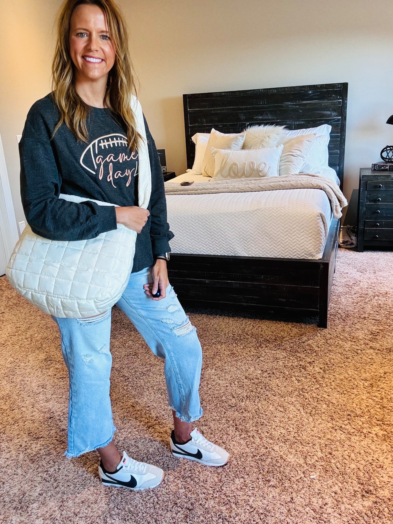 Game day ready but make it comfy 🏈🖤 Loving this laid-back look — graphic sweatshirt for $23, ripped denim, and classic Nike kicks for an easy weekend vibe. Perfect for football season or just running around town.

Shop the full look here! 🤍
#GameDayStyle #LTKFallFashion #CasualOOTD #MomStyle #LTKFinds

#LTKStyleTip #LTKFindsUnder50 #LTKOver40