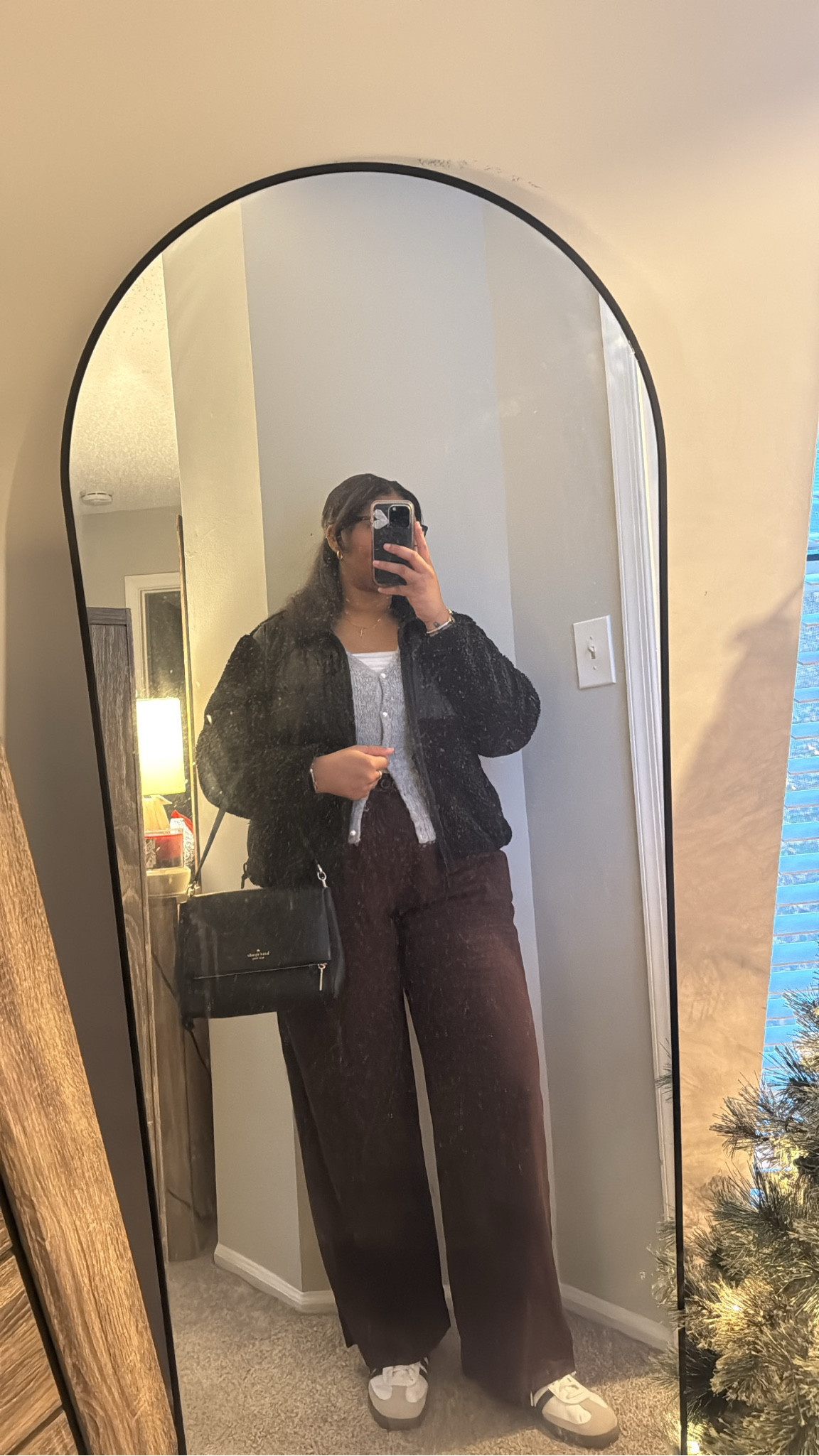 Neutral tones for a polished workday look. 🖤 This cozy black jacket layered over a simple knit sweater and tank, paired with flowy purple trousers and sneakers, is giving comfy yet boss vibes. Find the pieces on LTK! #LTKneutralstyle #workoutfitideas #effortlessfashion

#LTKFindsUnder50 #LTKWorkwear #LTKItBag
