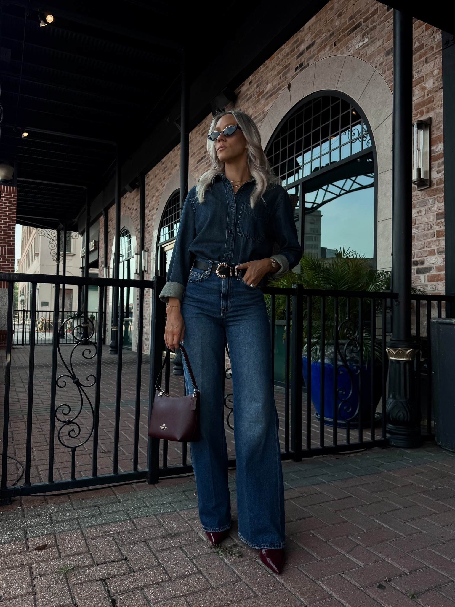 Levi Wide leg rib cage denim 24
Button down denim top XS
Gold black belt 
Cherry red pointed toe shoes
Black and gold sunglasses
Gold watch 

Work outfit, fall outfit, denim outfit, country concert outfit, travel look, coach bag, coach, Levi jeans, wide leg jeans 

#LTKWorkwear #LTKFindsUnder50 #LTKTravel