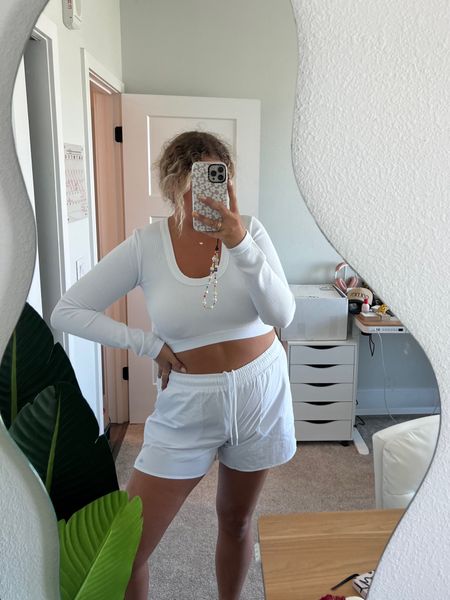 All white athleisure outfit from Alo Yoga

Cropped long sleeve top, athletic drawstring shorts

#LTKmidsize #LTKfitness #LTKcurves