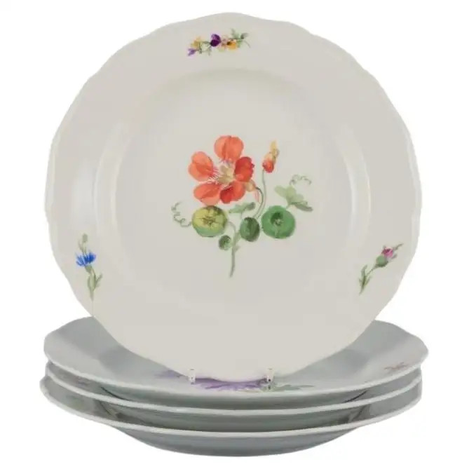 Meissen, Germany. Set of four porcelain dinner plates with floral motifs. | 1stDibs