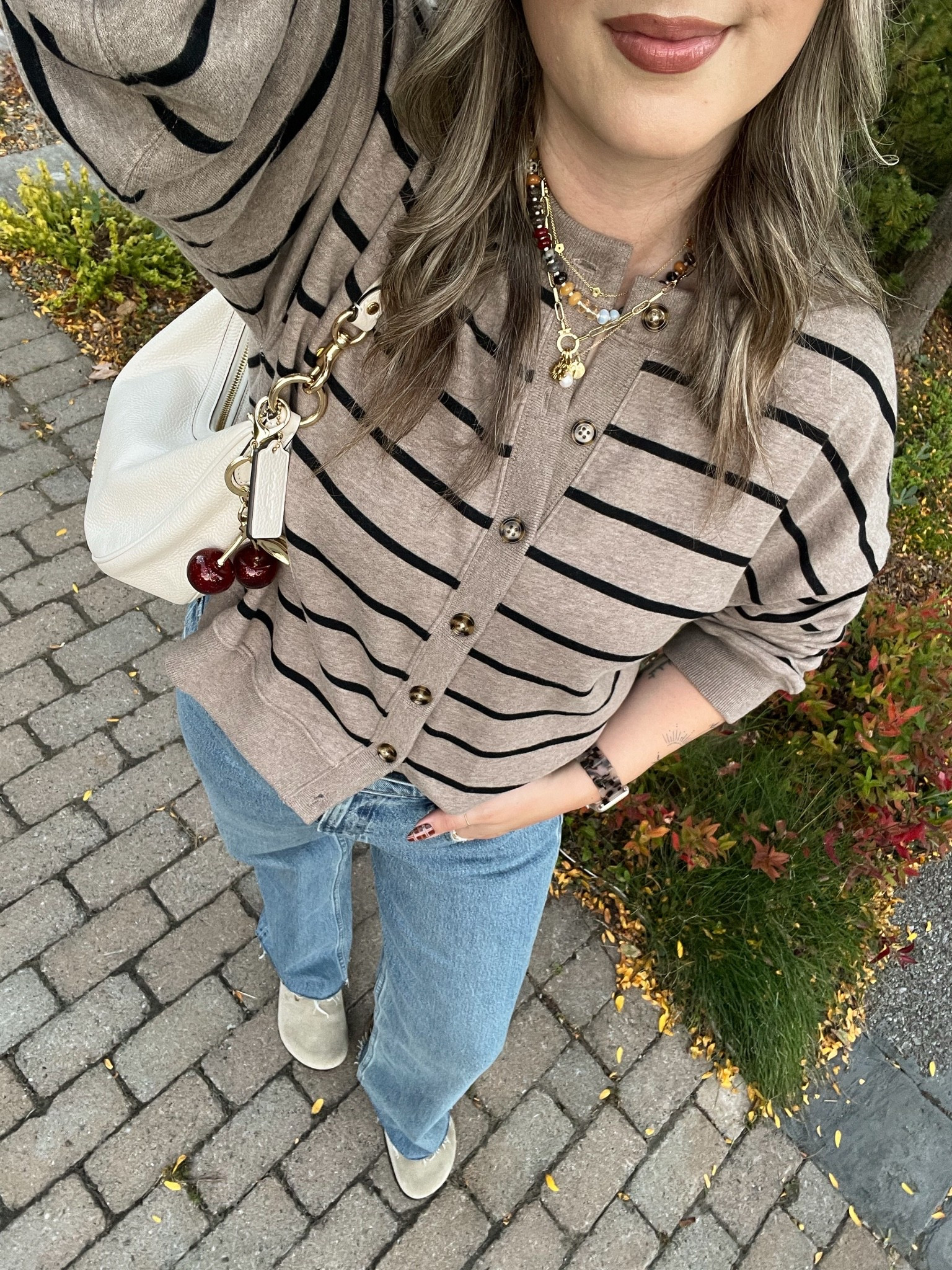 Casual fall outfit! Wearing L in the striped sweatshirt cardigan and 30 in the jeans. I’m a 9.5-10 shoe and wear a 40 in the Birkenstock clogs

#LTKfall #LTKjeans #LTKstyletip