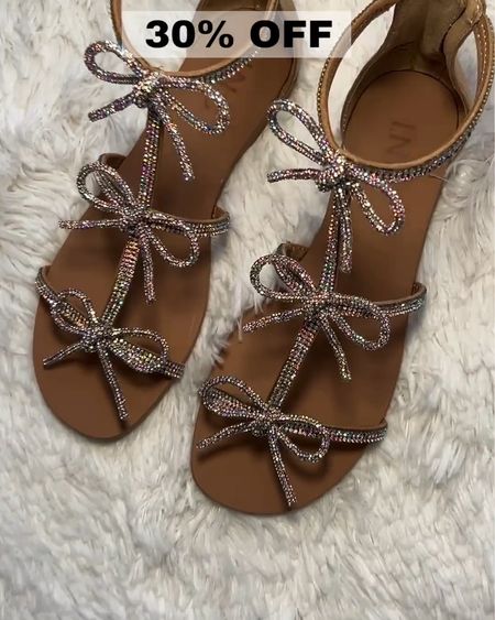 Add a little Sparkle to your step with these Rhinestone trimmed flat Sandals all tied up in a sparkling bow --

MACY’S is having a SUPER SALE on shoes at 30% OFF my Friend!!!! 🎉
These super comfy Sandals are on SALE for 30% OFF and glisten in the bright sun ☀️ 

I just bought 4 new pairs all shown below - Just click to see them!!!
Spring Outfit - Work Outfit - Vacation- Boots - Sale Alert - Under50 - SALE - Date Night Outfits - Vacation Outfits - Sandals- Shoe Crush 

Follow my shop @fashionistanyc on the @shop.LTK app to shop this post and get my exclusive app-only content! Be sure to ring my bell 🔔 to be notified of Sale Alerts!!

#liketkit #LTKSeasonal #LTKstyletip #LTKfindsunder100 #LTKshoecrush #LTKsalealert #LTKfindsunder50 #LTKfindsunder50 #LTKsalealert #LTKFestival
@shop.ltk
https://liketk.it/4DzvK