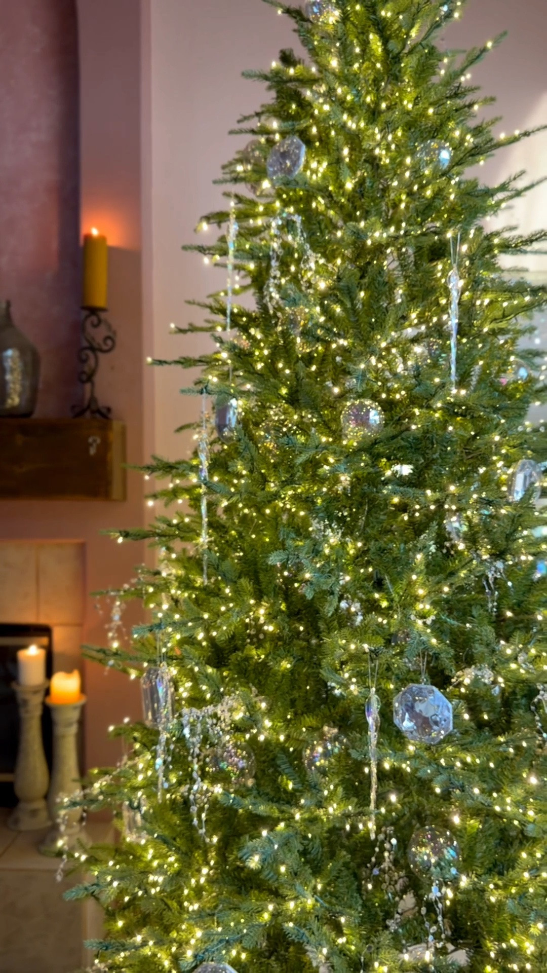 How to style the Home Depot Grand Duchess tree without covering up so the beautiful lights! Go for ornaments that reflect the twinkle, like smooth iridescent baubles. multifaceted jewels and long twisted icicles. Even a small splash of these pieces makes a huge impact on your tree. 😍 Check out the ornaments and tree linked here.

#LTKSeasonal #LTKHome #LTKvlog